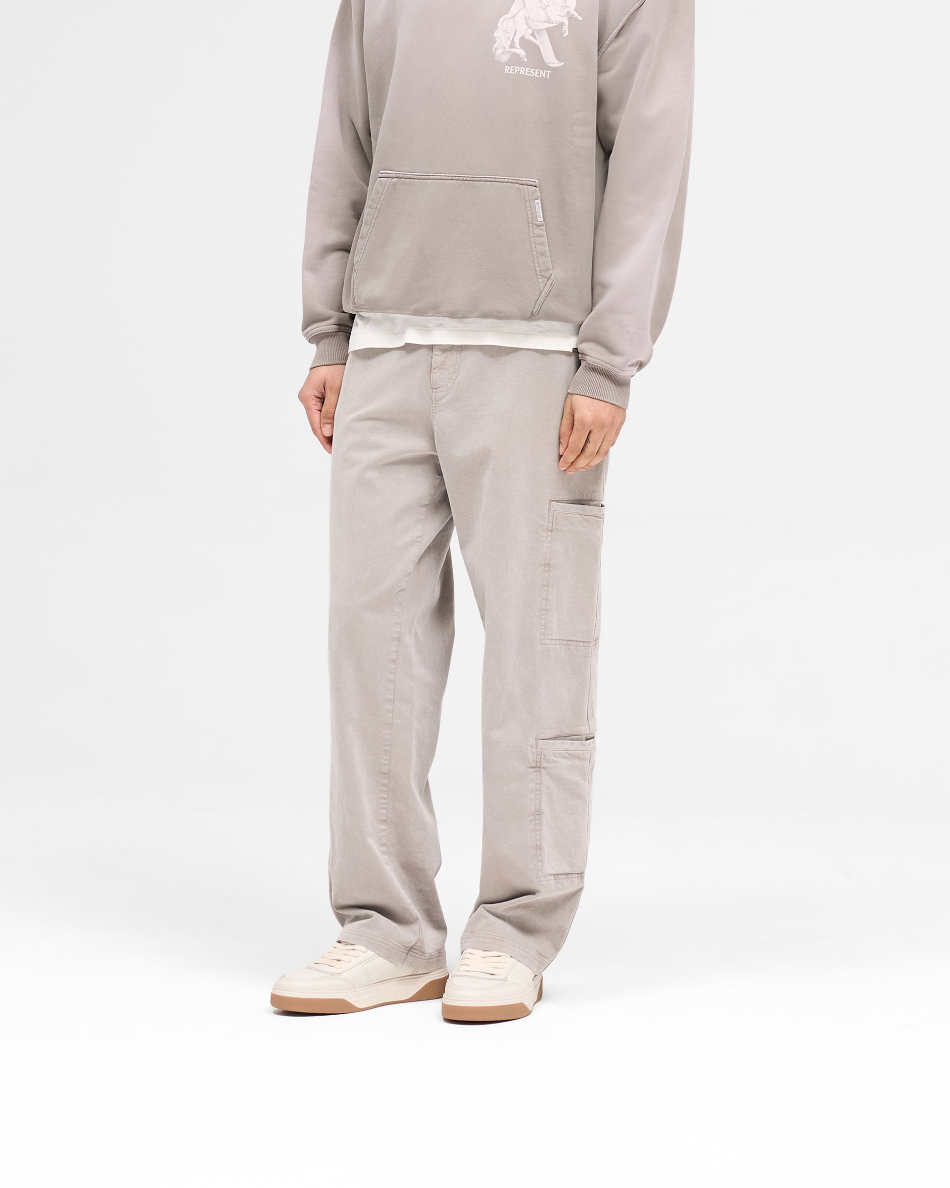 Back product image of mens taupe pants on a plain white background | Season Cargo Pant in Washed Taupe | Cargo pants with eight pockets and YKK fly | SS25 Pants | Represent Clo