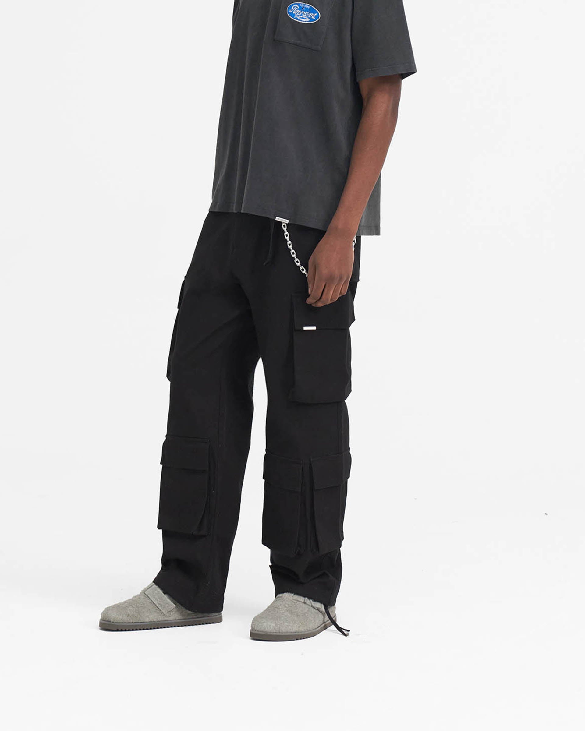 Back product image of mens black pants on a plain white background | Baggy Cargo Pant in Black | Black baggy fit cargo pants with 3D oversized pockets | SS24 Pants | Represent Clo