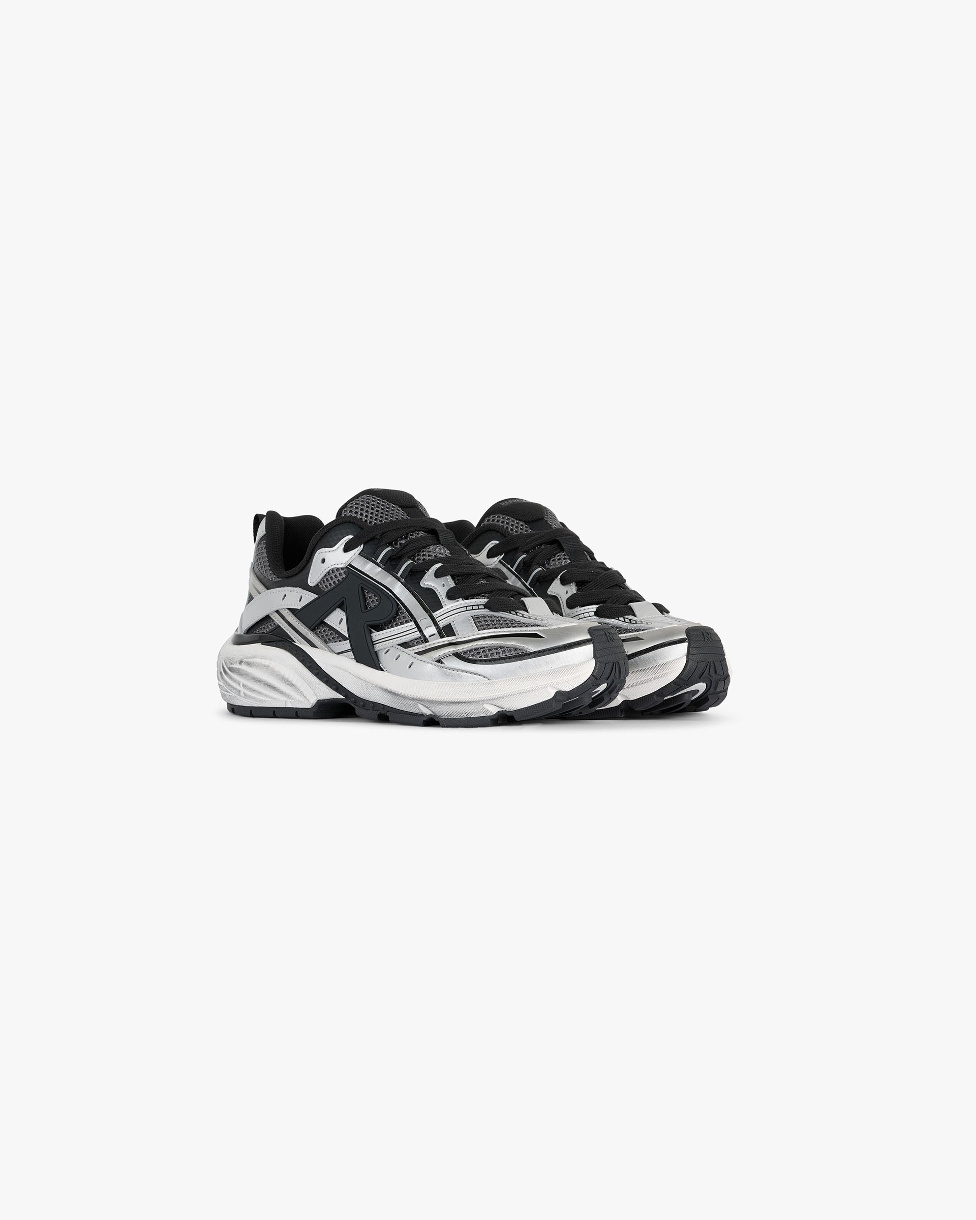 Back product image of mens black and silver sneaker on a plain white background | Storm Runner in Silver Black | Sneaker with mesh upper and EVA midsole | FW24 Footwear | Represent Clo