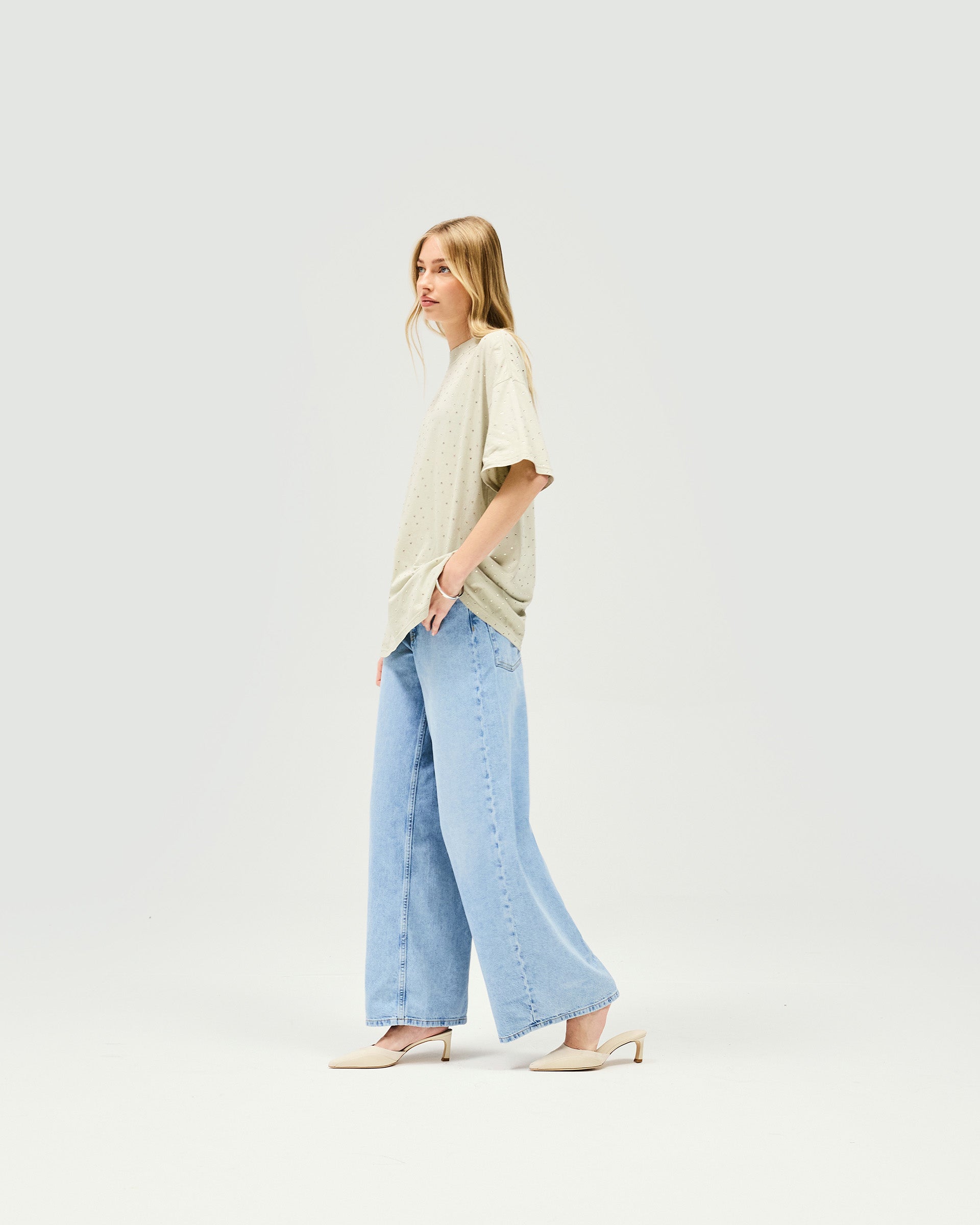Back product image of a womens grey t-shirt on a plain white background | Spark T-Shirt in Storm | Oversized fit t-shirt with hot fix detail | Womens SS25 Tops | Represent Clo