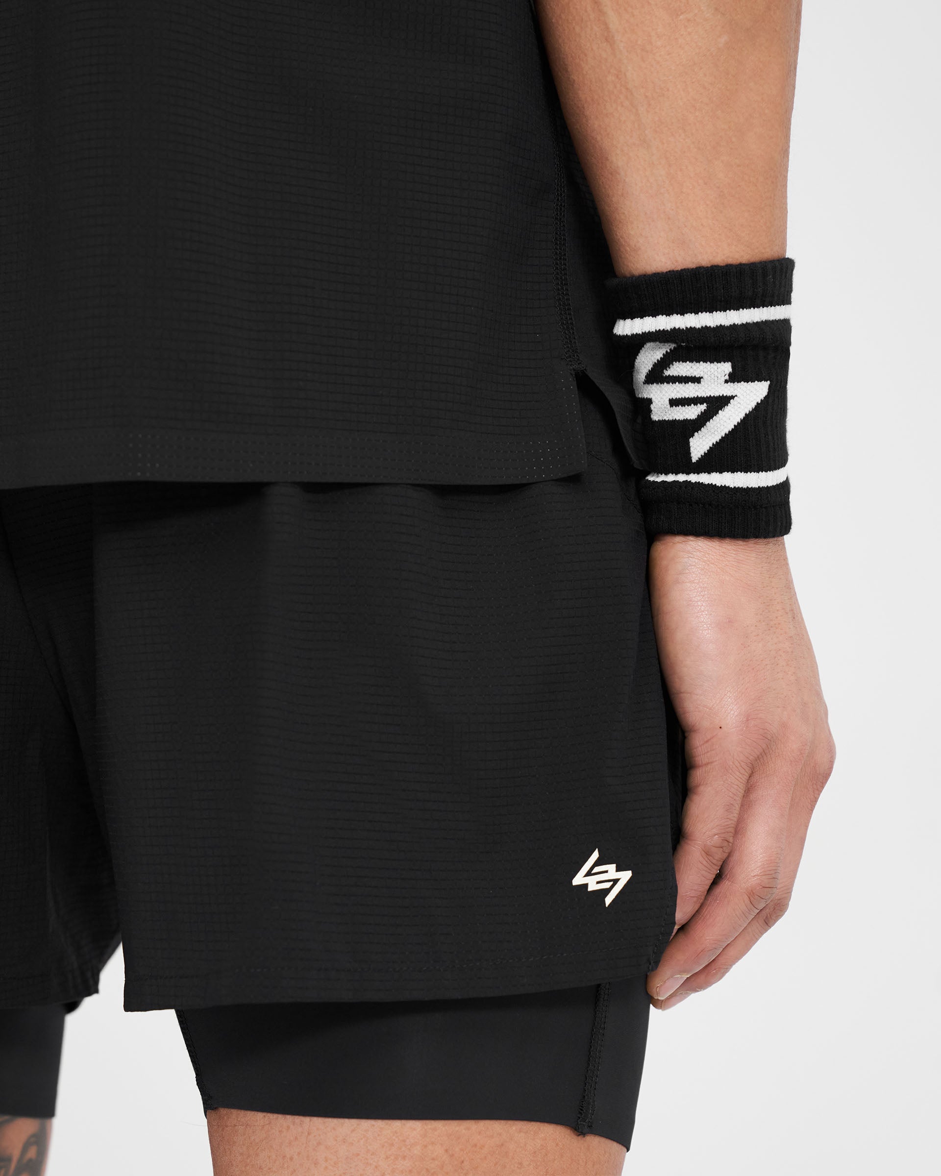 Back product image of mens black wristbands on a plain white background | 247 Logo Wrist Bands in Black | Cotton wristbands with 247 logo | 247 Accessories | Represent Clo