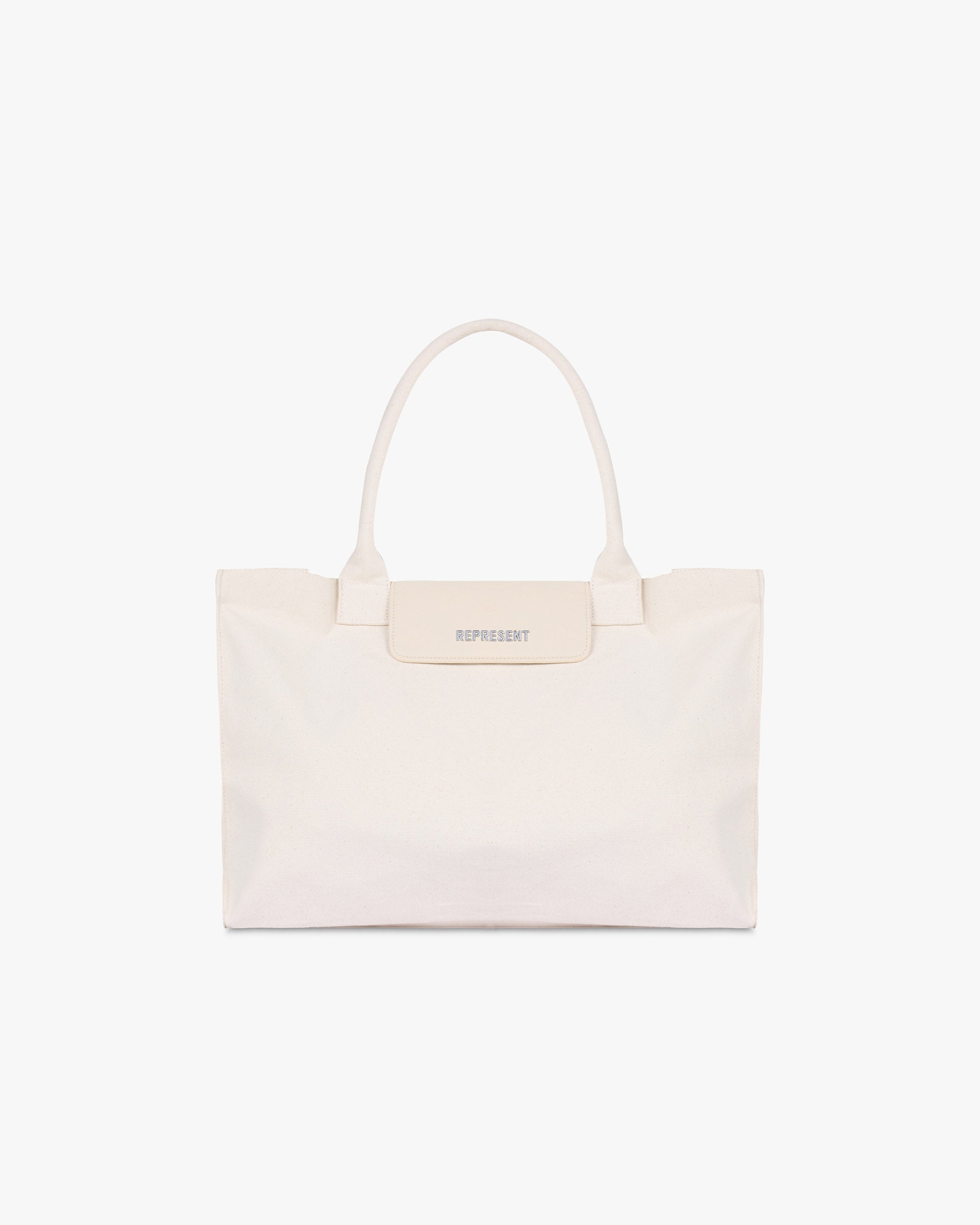 Front product image of a mens white canvas tote bag on a plain white background | Canvas Tote Bag in Antique White | Tote bag with premium construction | SS25 Accessories | Represent Clo