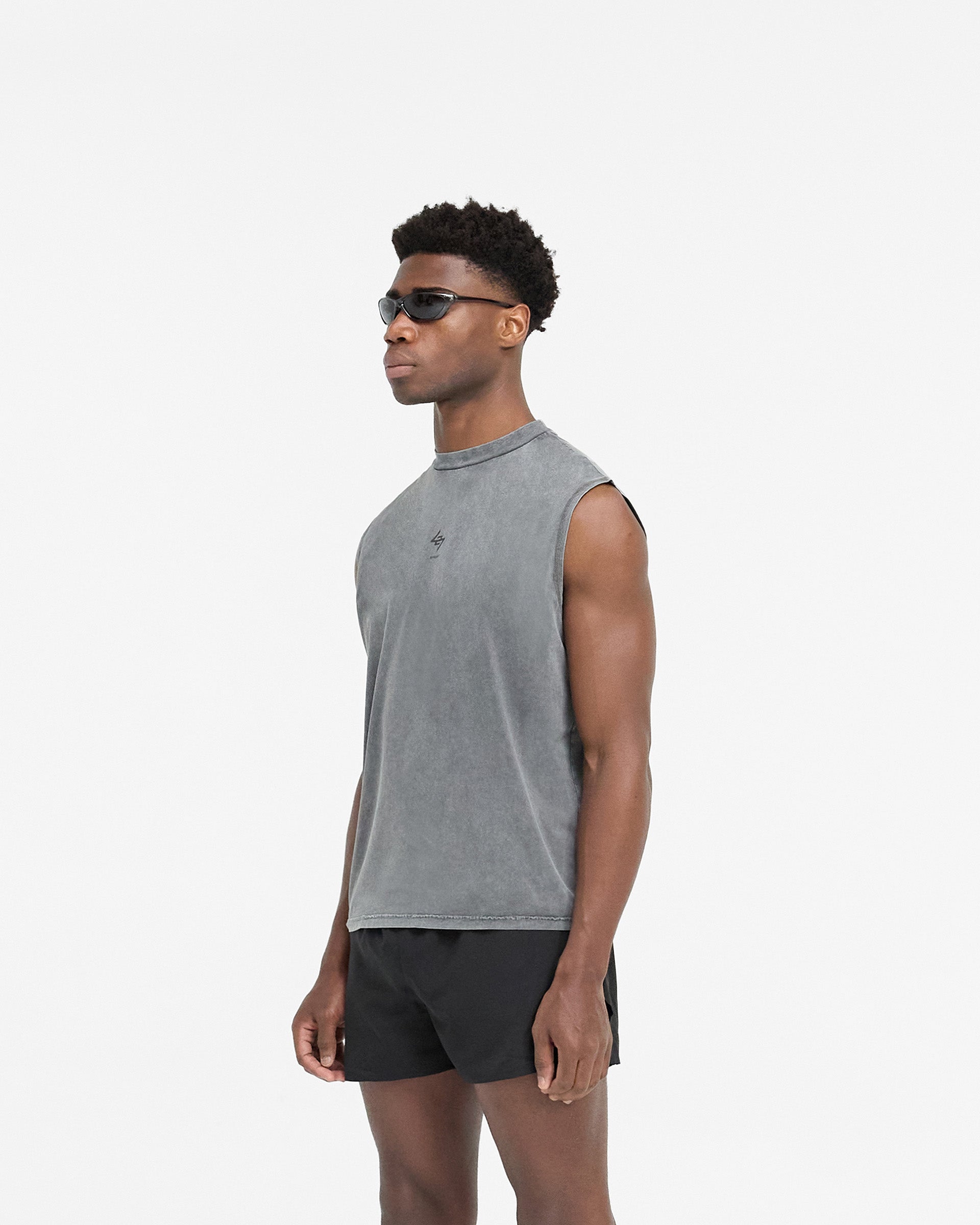 Man wearing a grey oversized tank on a plain white background | 247 Oversized Tank in Pewter | Lightweight breathable tank with 247 branding | 247 T-Shirts | Represent Clo