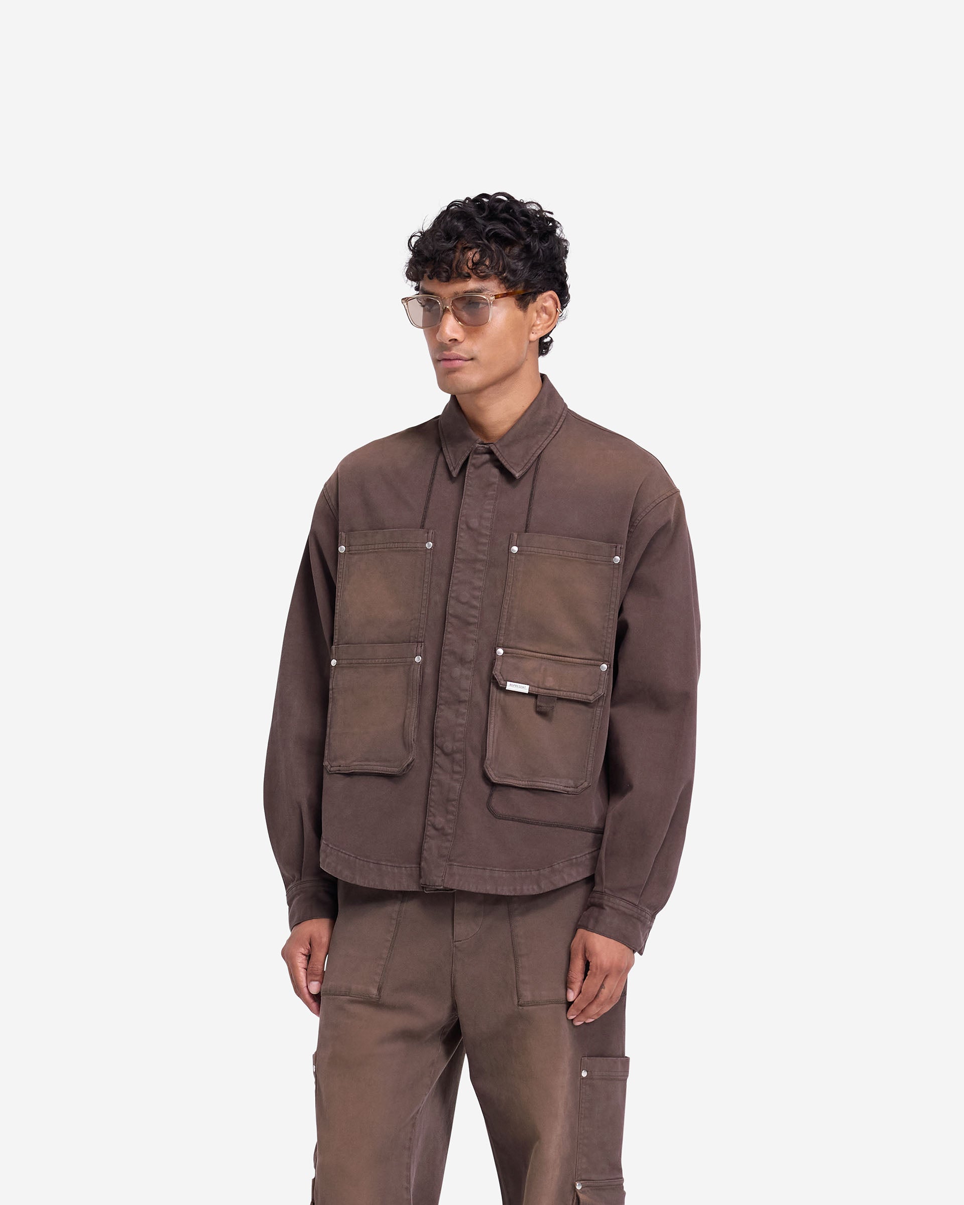 Back product image of a mens brown shirt on a plain white background | Workshop Shirt in Cedar | Shirt with back yoke and popper cuff adjusters | FW24 Shirts | Represent Clo