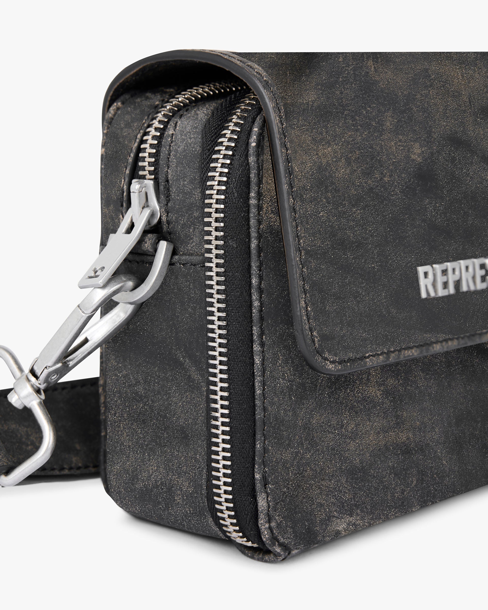 Back product image of a mens brown leather bag on a plain white background | Distressed Leather Camera Bag in Brown | Leather camera bag with adjustable strap | FW24 Accessories | Represent Clo