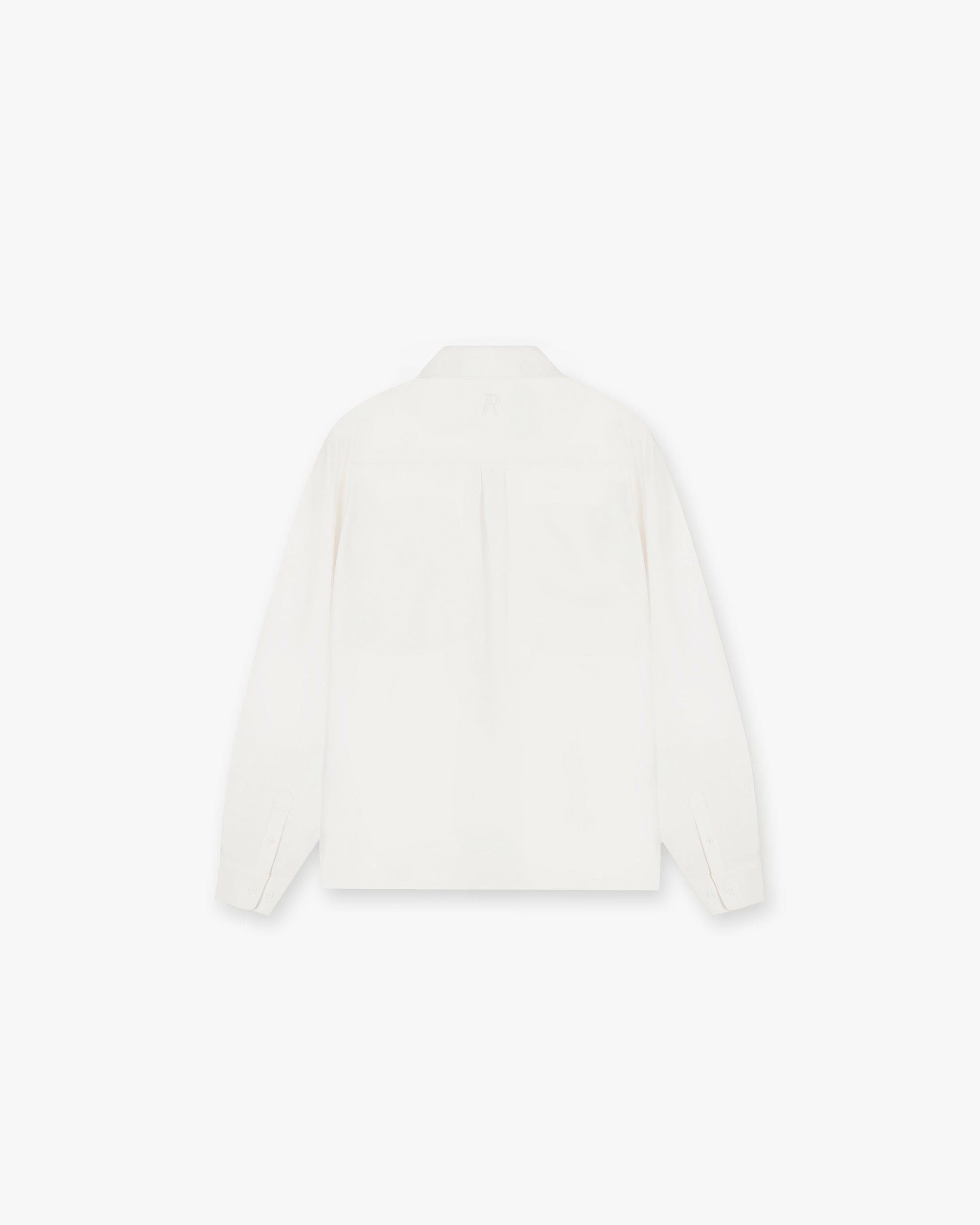 Back product image of a mens white shirt on a plain white background | Initial Shirt in Flat White | Drapey fabric with chest pockets and concealed placket | Initial Shirts | Represent Clo