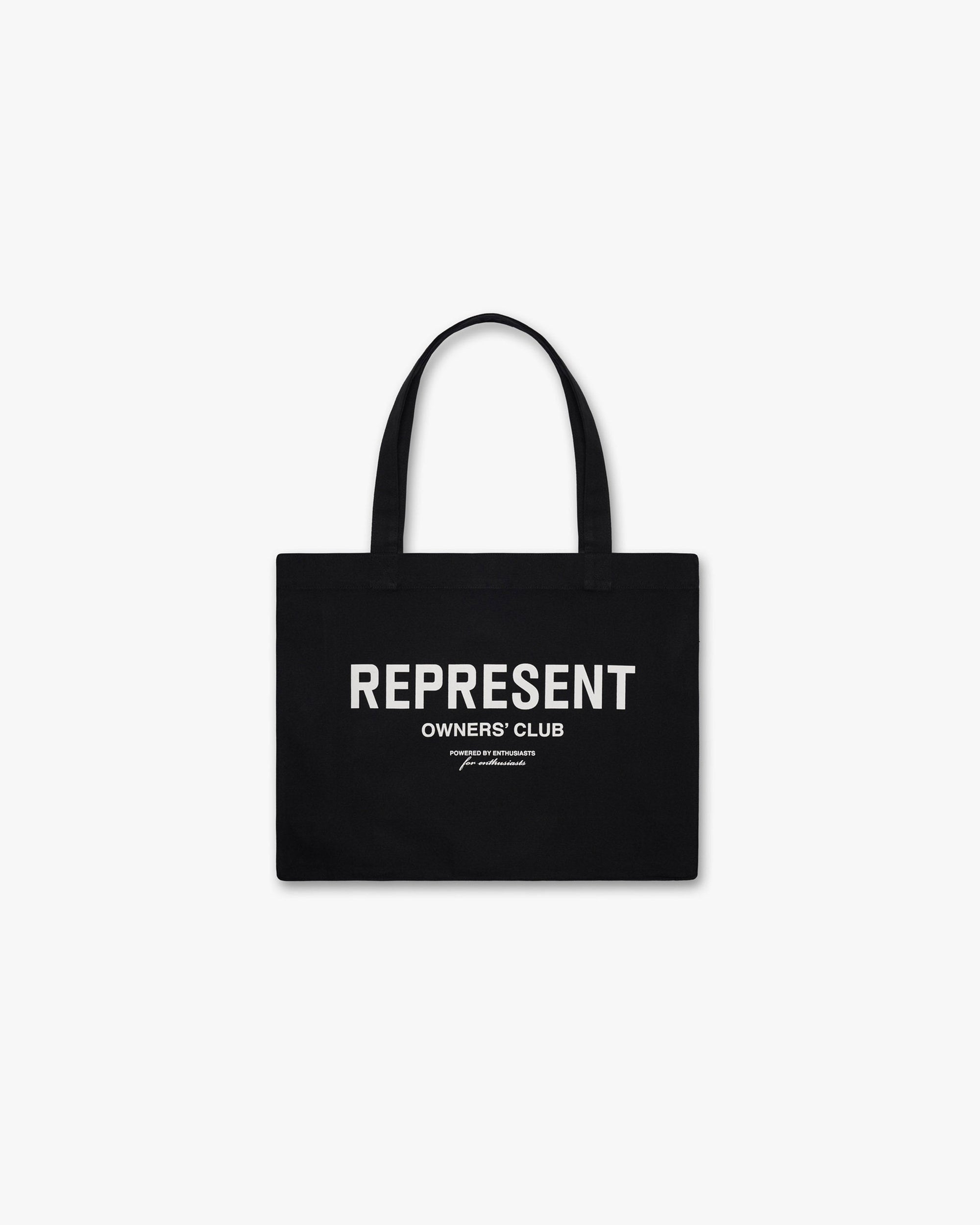 Front product image of a mens black tote bag with white branding on a plain white background | Owners Club Tote Bag in Black/White | Tote bag with logo print | Owners Club Accessories | Represent Clo