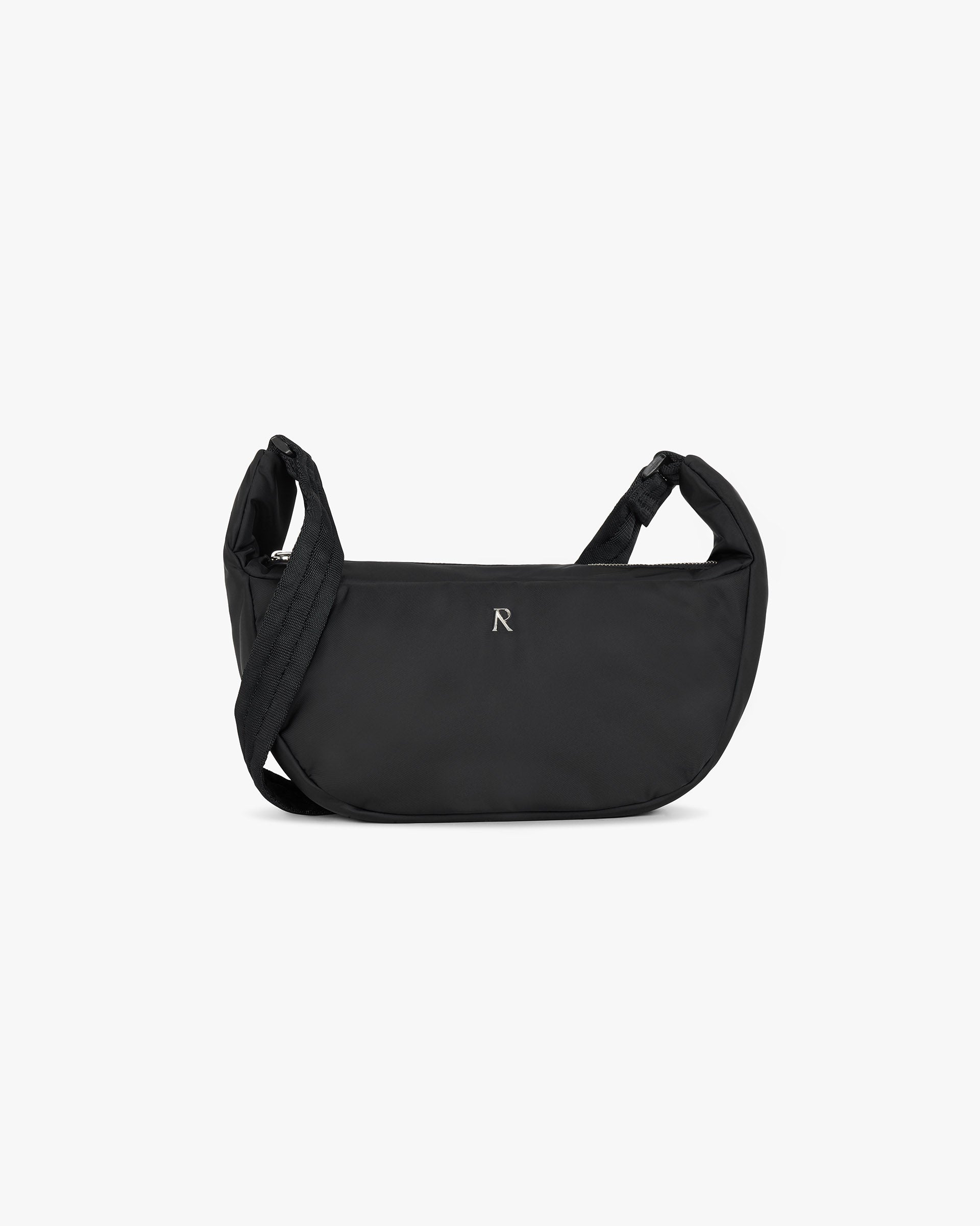 Front product image of a mens black sling bag on a plain white background | Initial Nylon Sling Bag in Black | Versatile and compact nylon bag | FW24 Accessories | Represent Clo