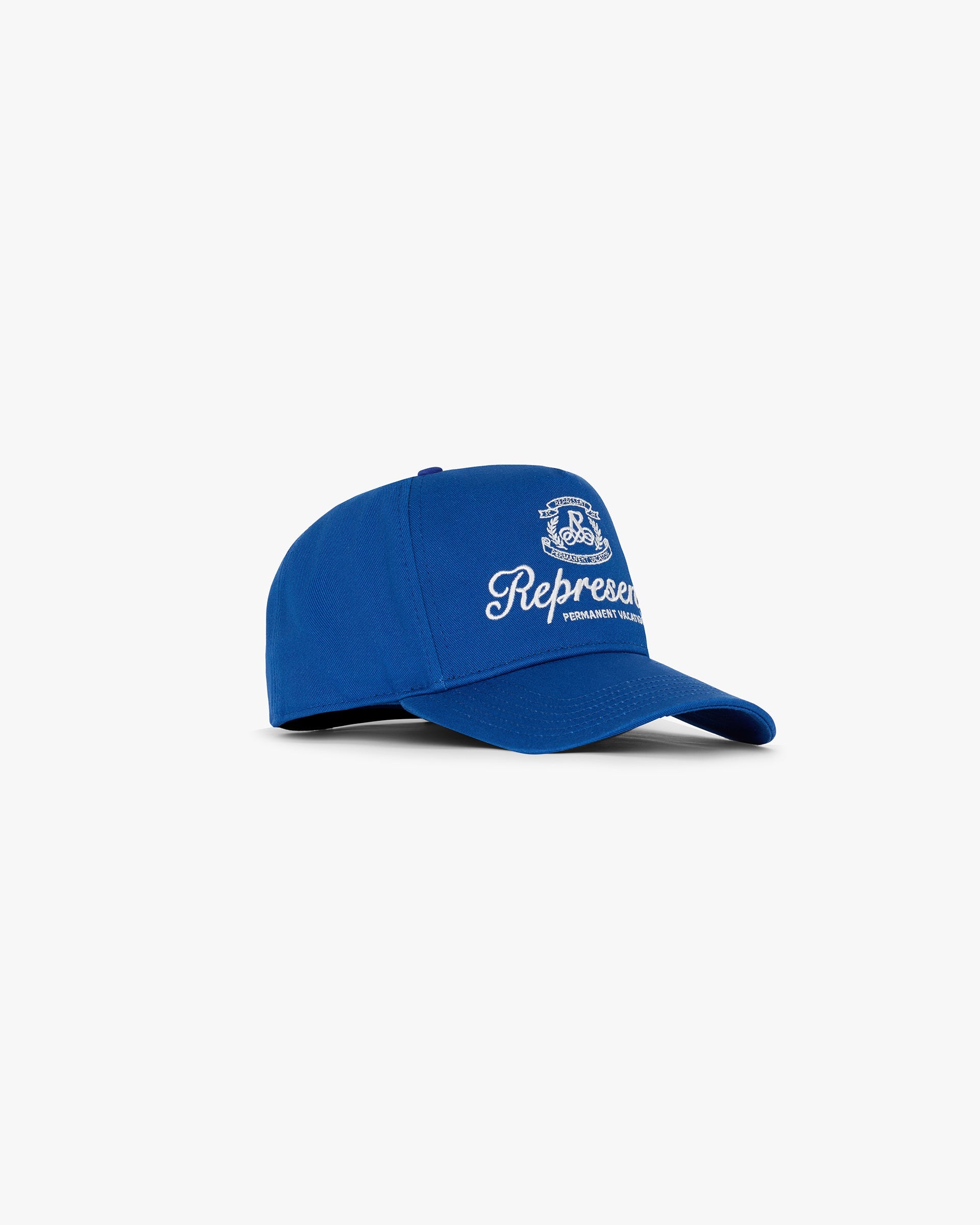 Front product image of a mens blue cap on a plain white background | Permanent Vacation Cap in Royal Blue | Cap with Represent metal bar logo | SC24 Accessories | Represent Clo