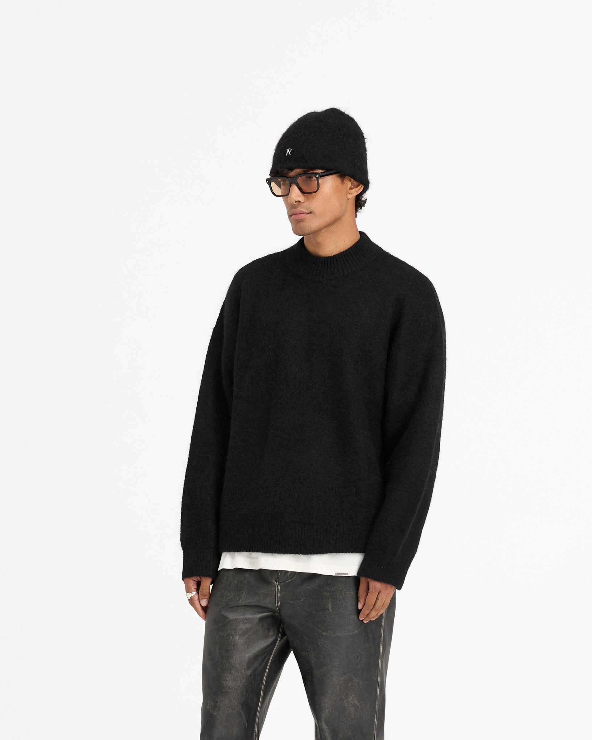 Back product image of a mens black sweater on a plain white background | Alpaca Blend Sweater in Jet Black | Oversized alpaca knitwear with ribbed details | FW24 Knitwear | Represent Clo