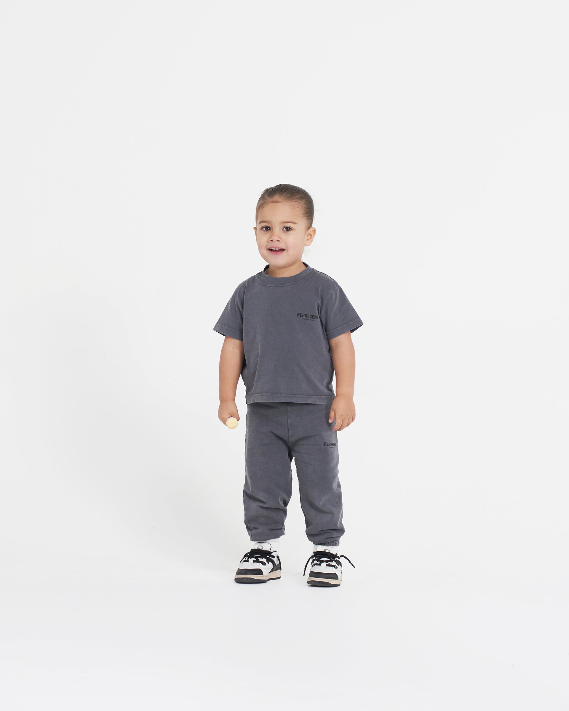 Back product image of a children's grey sweatpants on a plain white background | Represent Mini Owners Club Sweatpants in Storm | Sweatpants with elasticated waistband | Owners Club Pants | Represent Clo