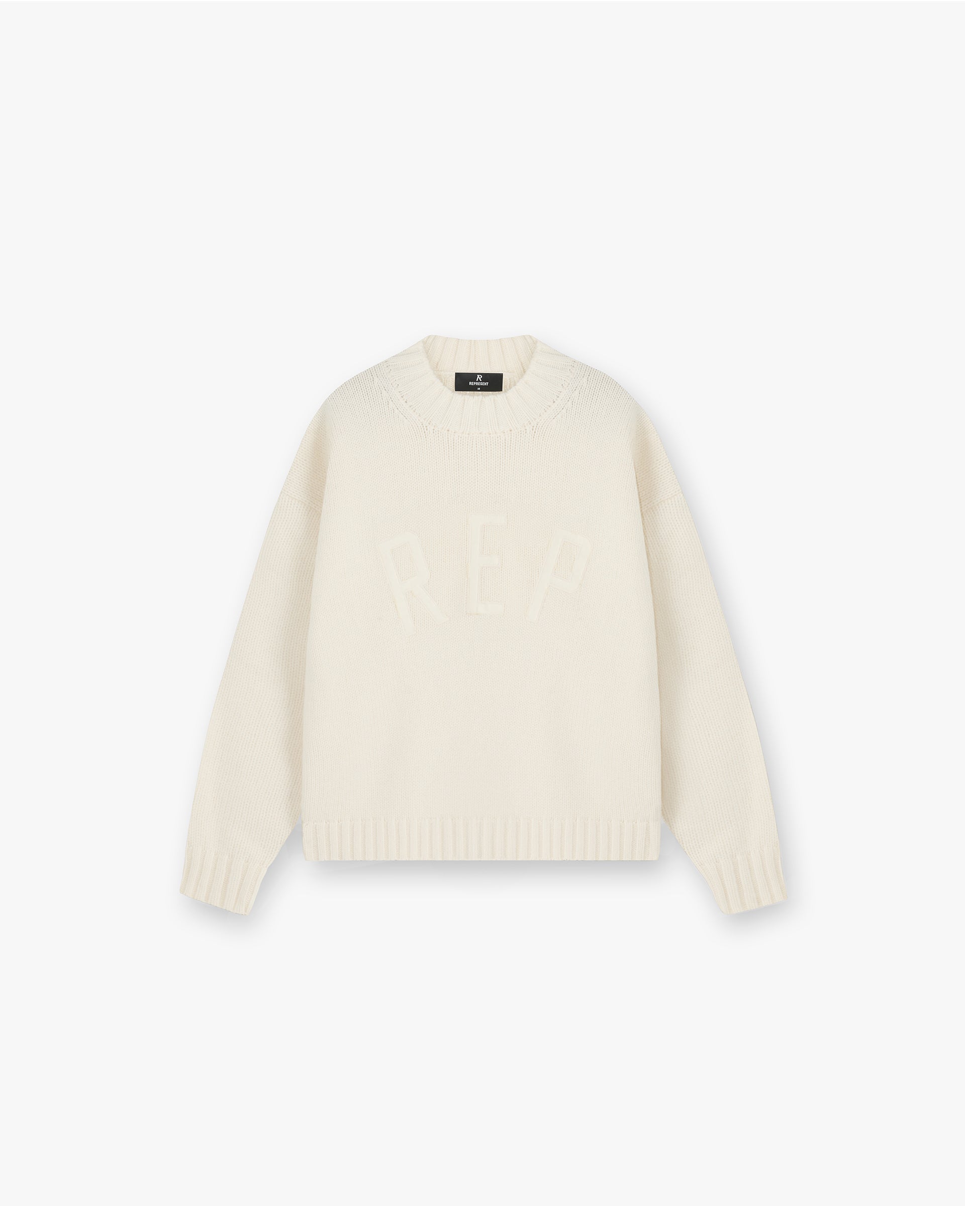 Front product image of a mens oat knit jumper on a plain white background | Rep Knit Jumper in Oat | Luxury knitwear with ribbed crewneck | FW24 Knitwear | Represent Clo