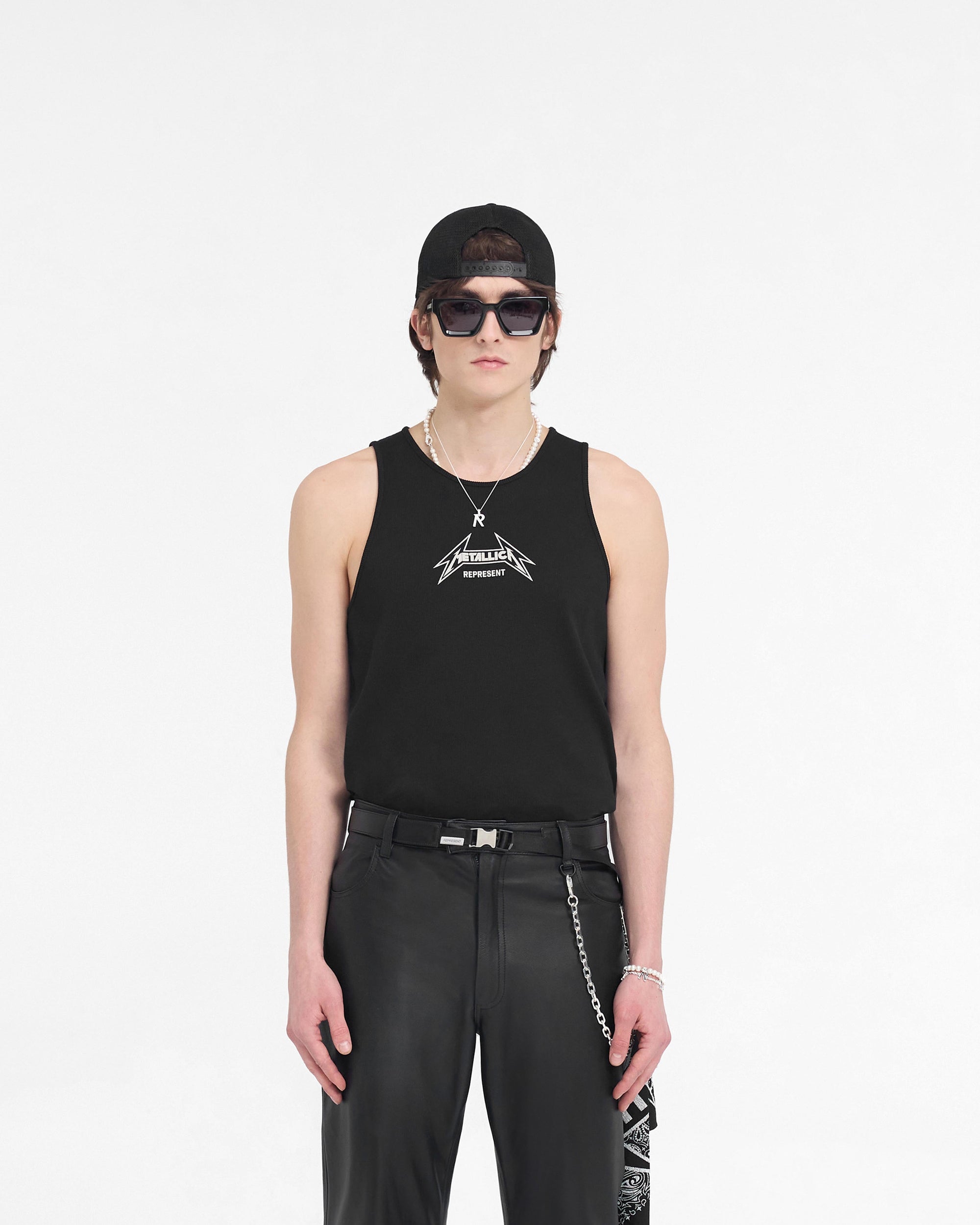 Man wearing a black vest on a plain white background | Represent X Metallica Local Crew Vest in Jet Black | Ribbed vest with Metallica logo | SS24 T-Shirts | Represent Clo