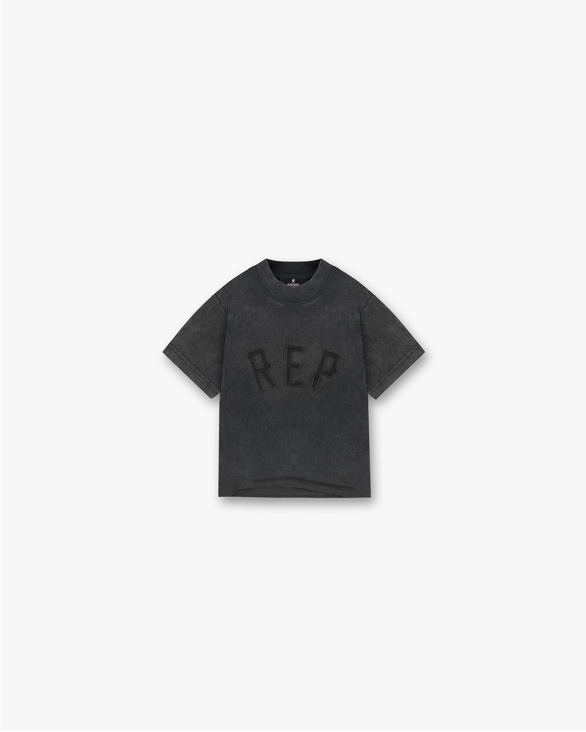 Front product image of a childs black t-shirt on a plain white background | Mini Rep Applique T-Shirt in Vintage Black | Childs oversized applique t-shirt | FW24 T-Shirts | Represent Clo
