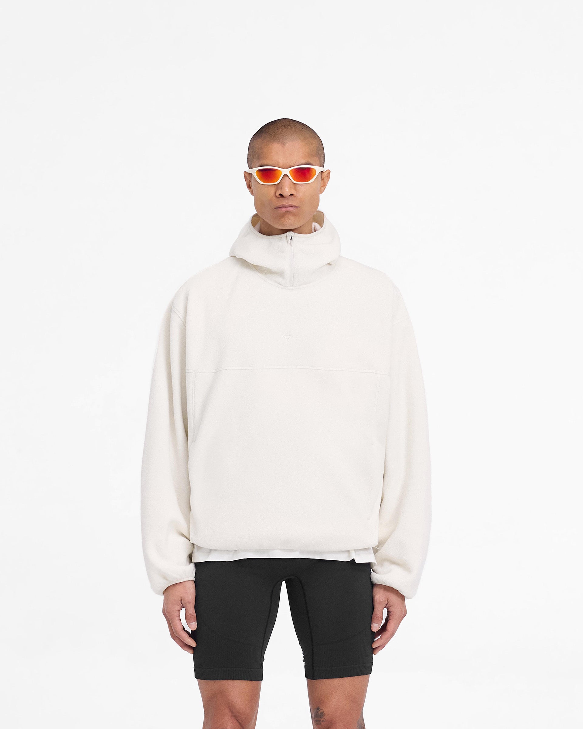 Man wearing an oversized fleece hoodie in white on a plain white background | 247 Fleece Hoodie in Papyrus | Oversized boxy fit hoodie with zip to high chin guard | 247 Hoodies | Represent Clo