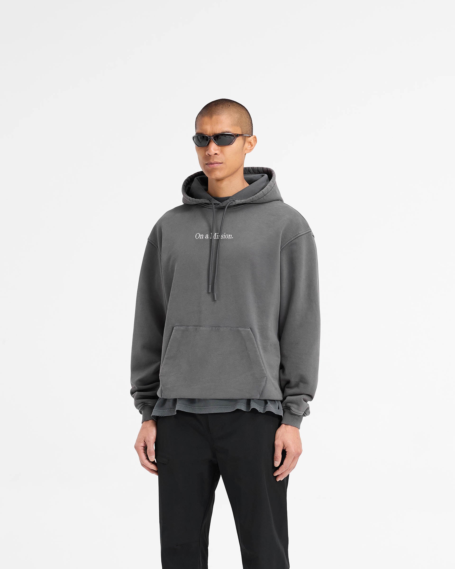 Back product image of a mens black hoodie on a plain white background | 247 On A Mission Hoodie in Aged Black | Slightly oversized hoodie with On a Mission embroidery and ribbed trims | 247 Hoodies | Represent Clo