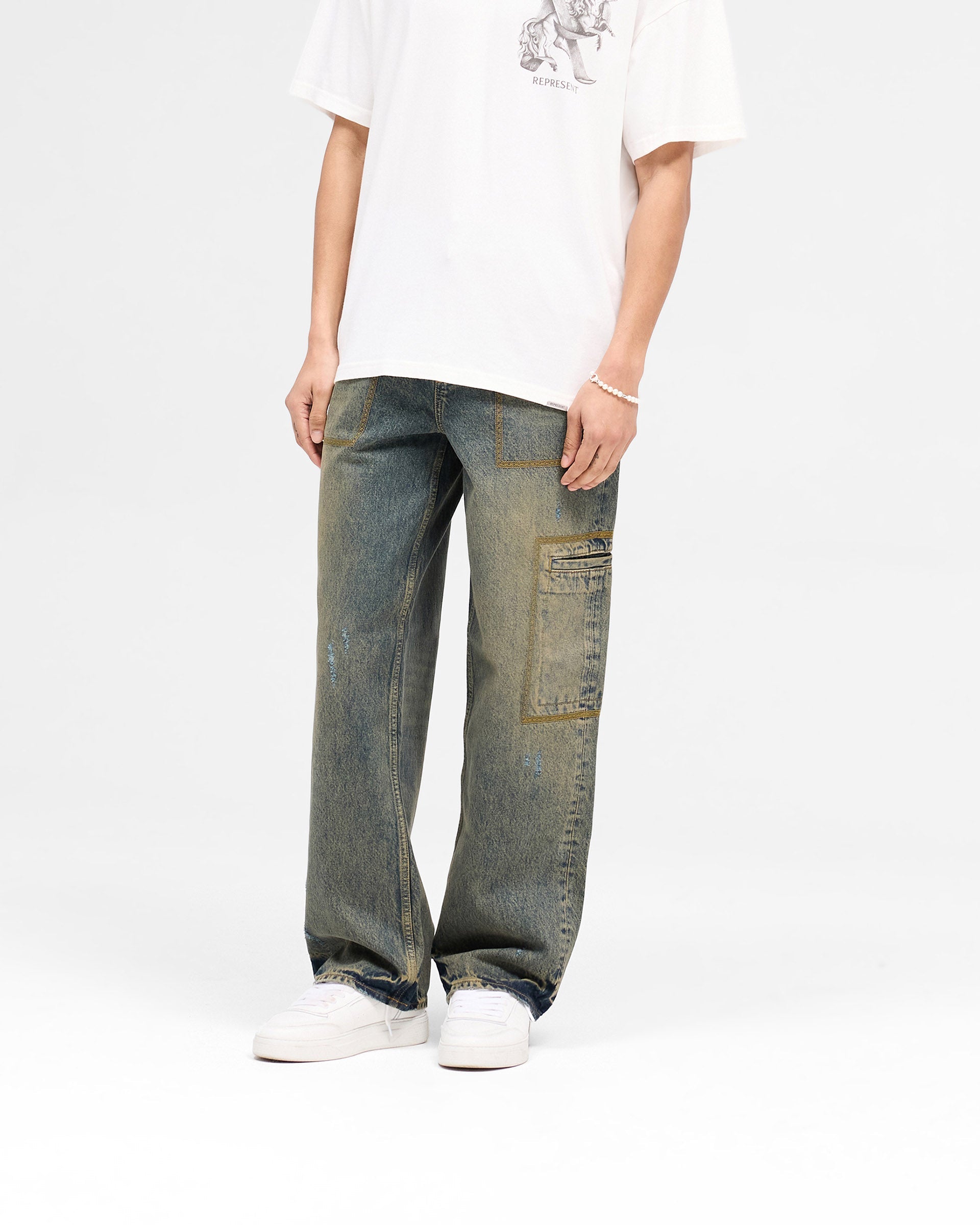 Back product image of mens blue jeans on a plain white background | R3 Drive Denim in Tobacco Blue | Baggy fit denim with distressed detailing | SS25 Denim | Represent Clo