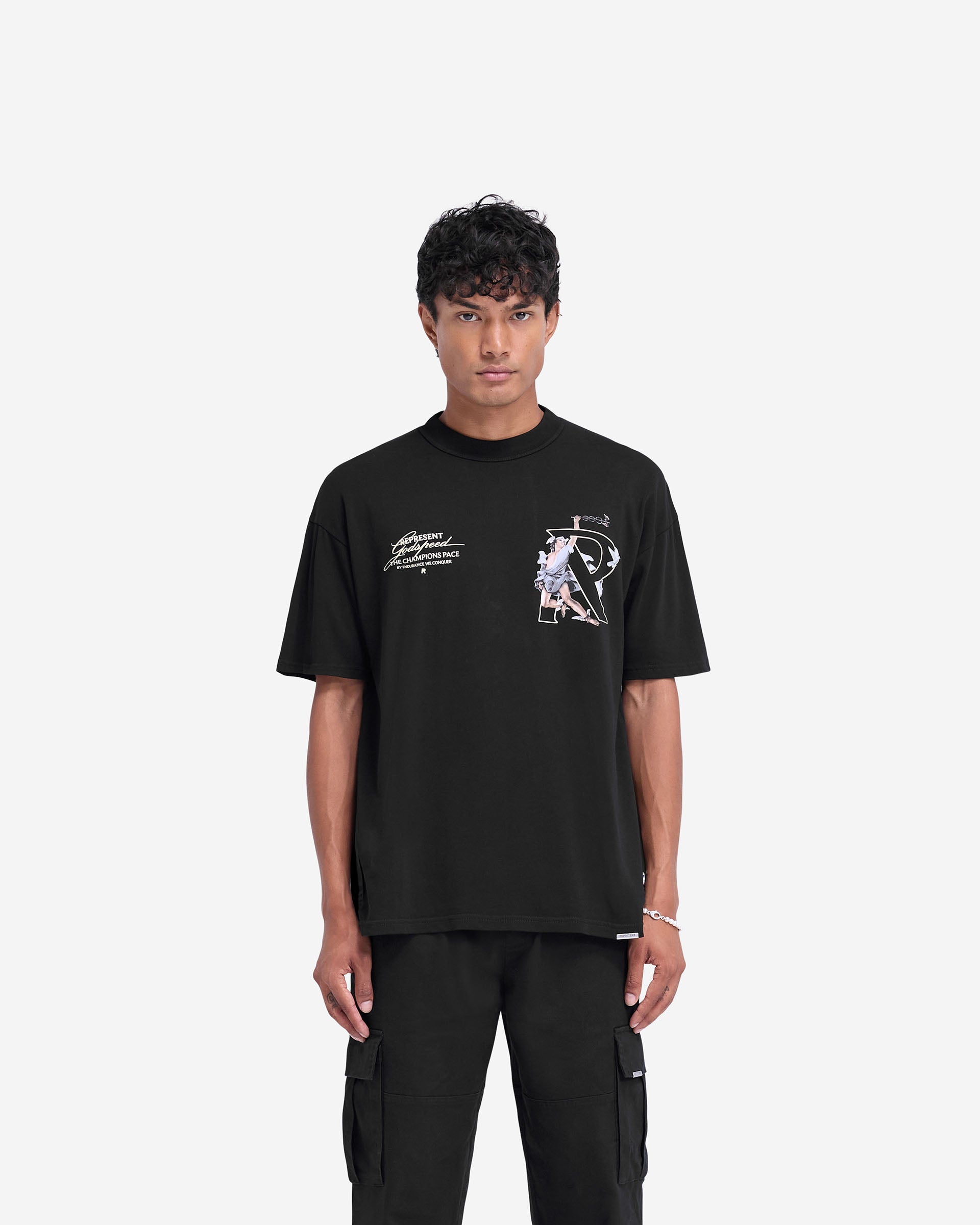 Man wearing a black oversized t-shirt on a plain white background | Hermes T-Shirt in Jet Black | Oversized t-shirt with screen print graphic and metal bar logo | FW24 T-Shirts | Represent Clo