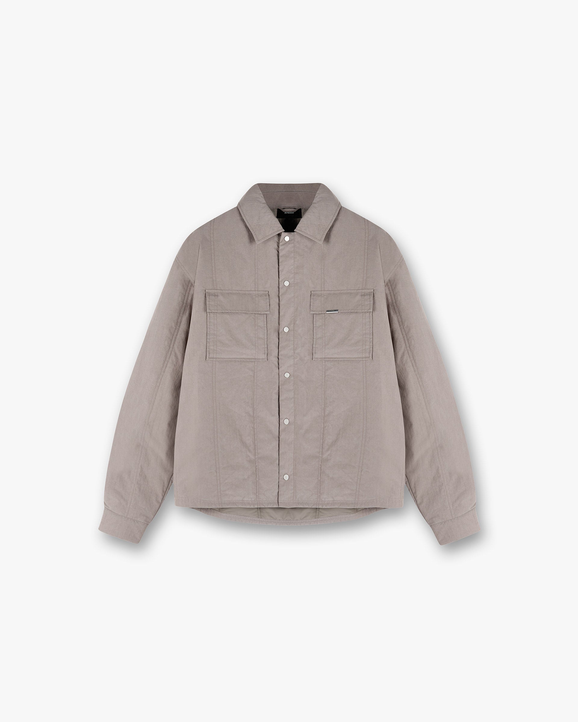 Front product image of a mens grey quilted overshirt on a plain white background | Quilted Overshirt in Mid Grey | Quilted shirt with a luxurious design | SS25 Shirts | Represent Clo