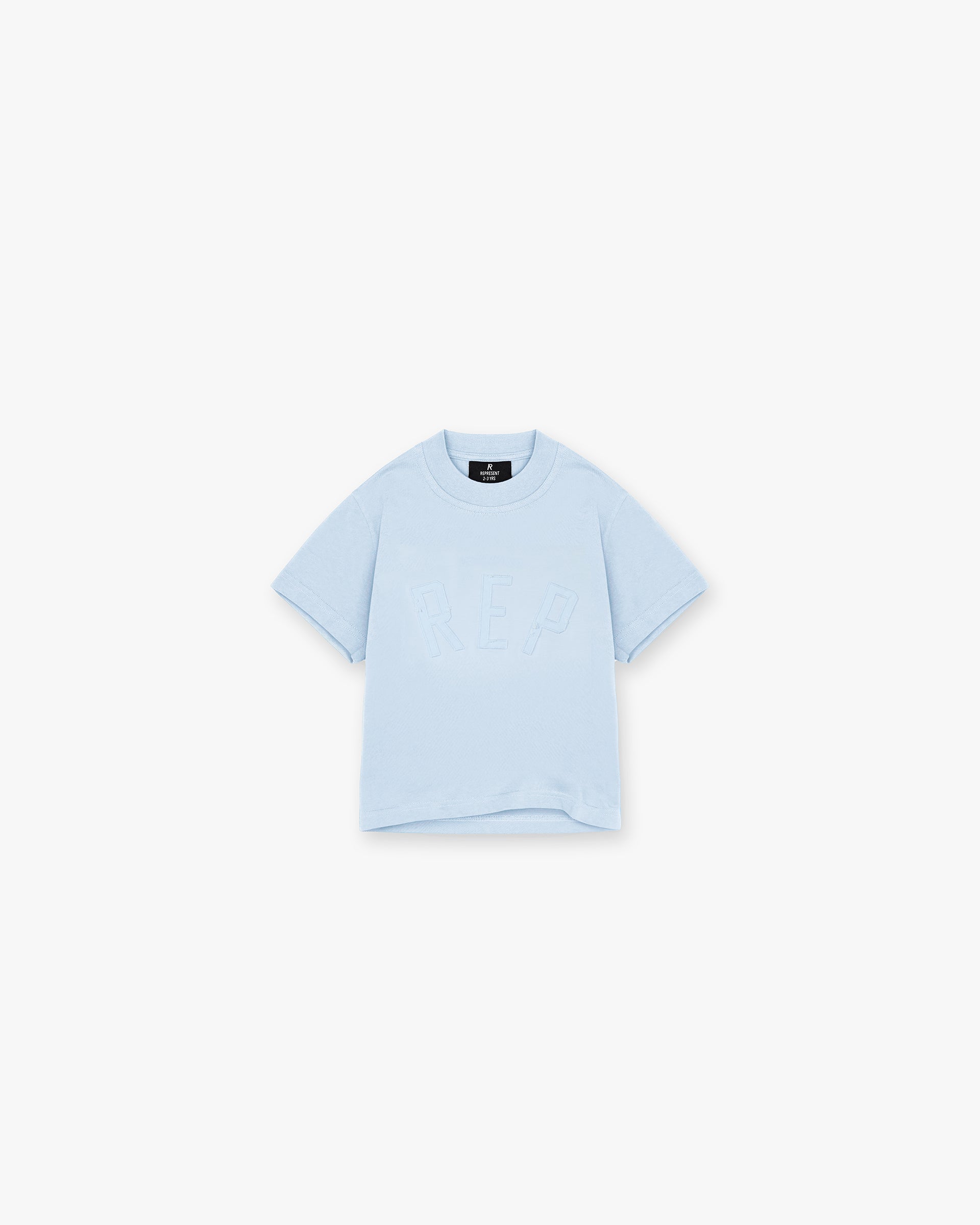 Front product image of a powder blue kids t-shirt on a plain white background | Mini Rep Applique T-Shirt in Powder Blue | Kids slightly oversized t-shirt with applique detail | FW24 T-Shirts | Represent Clo