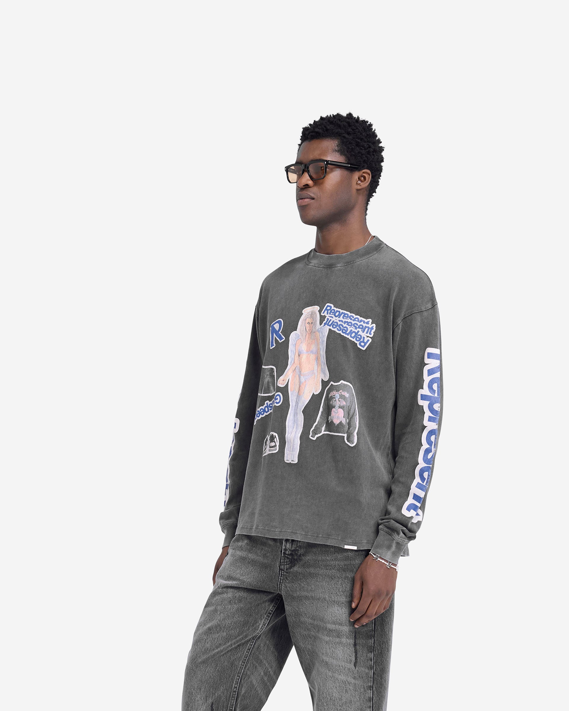 Man wearing a slightly oversized grey long sleeve t-shirt on a plain white background | Question Your Innocence Long Sleeve T-Shirt in Vintage Grey | Medium weight jersey cotton t-shirt with cracked print graphic and metal bar logo | FW24 T-Shirts | Represent Clo