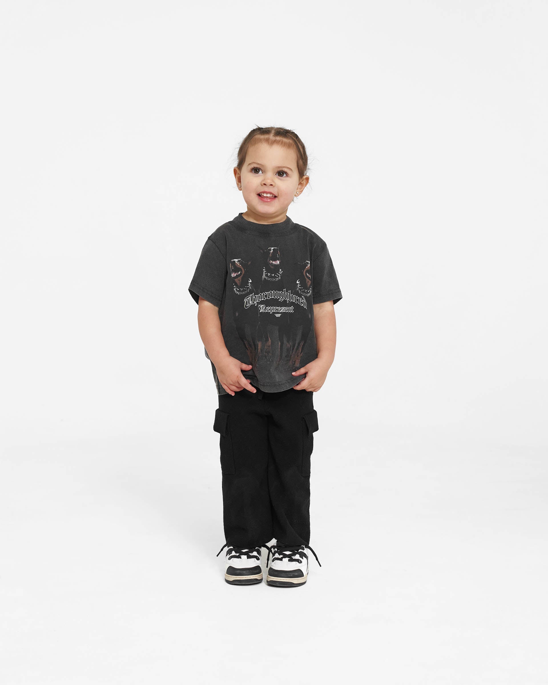 Back product image of a childs black t-shirt on a plain white background | Mini Thoroughbred T-Shirt in Vintage Black | Oversized kids t-shirt with graphic front | Mini T-Shirts | Represent Clo