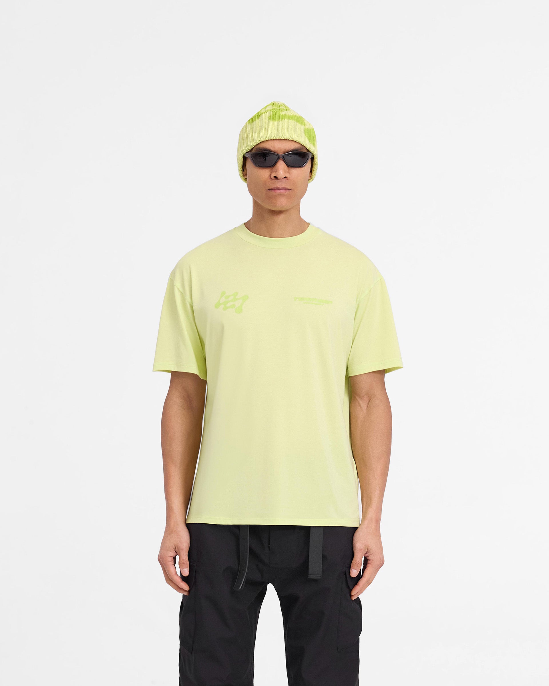 Man wearing a shadow lime t-shirt on a plain white background | 247 Future Terrains Oversized T-Shirt in Shadow Lime | Oversized t-shirt with quick drying fabric | 247 T-Shirts | Represent Clo