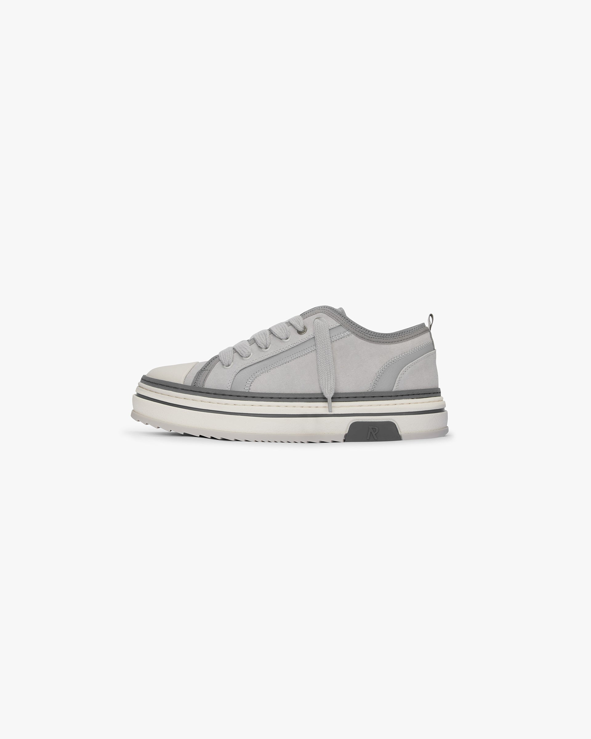 Mens grey sneaker on a plain white background | HTN X Low in Warm Grey | Low top sneaker with canvas upper and chunky rubber outsole | SS24 Footwear | Represent Clo