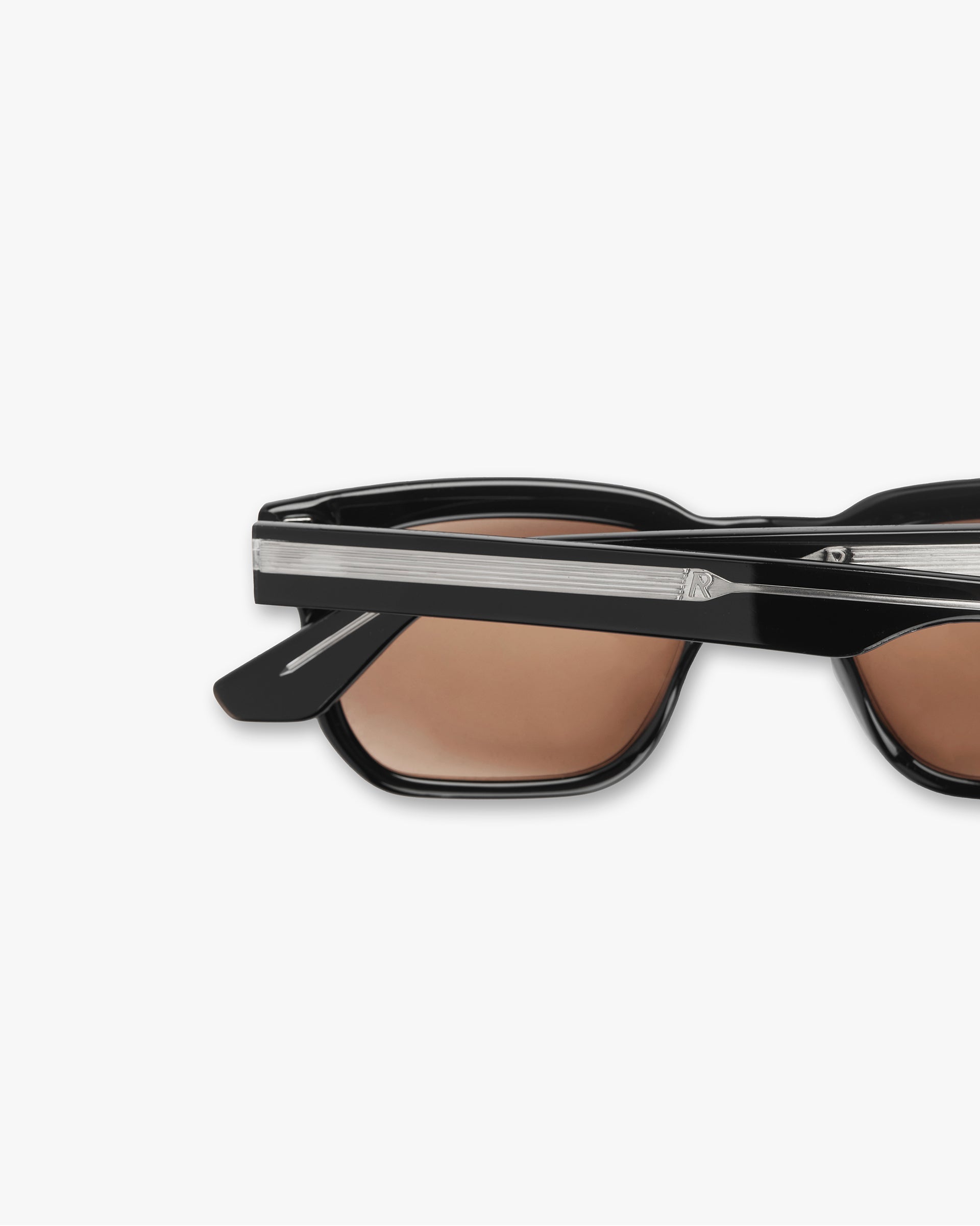 Product image of mens black sunglasses on a plain white background | Represent Hamptons Sunglasses in Jet Black | Acetate frames with orange tint lenses | SS24 Accessories | Represent Clo