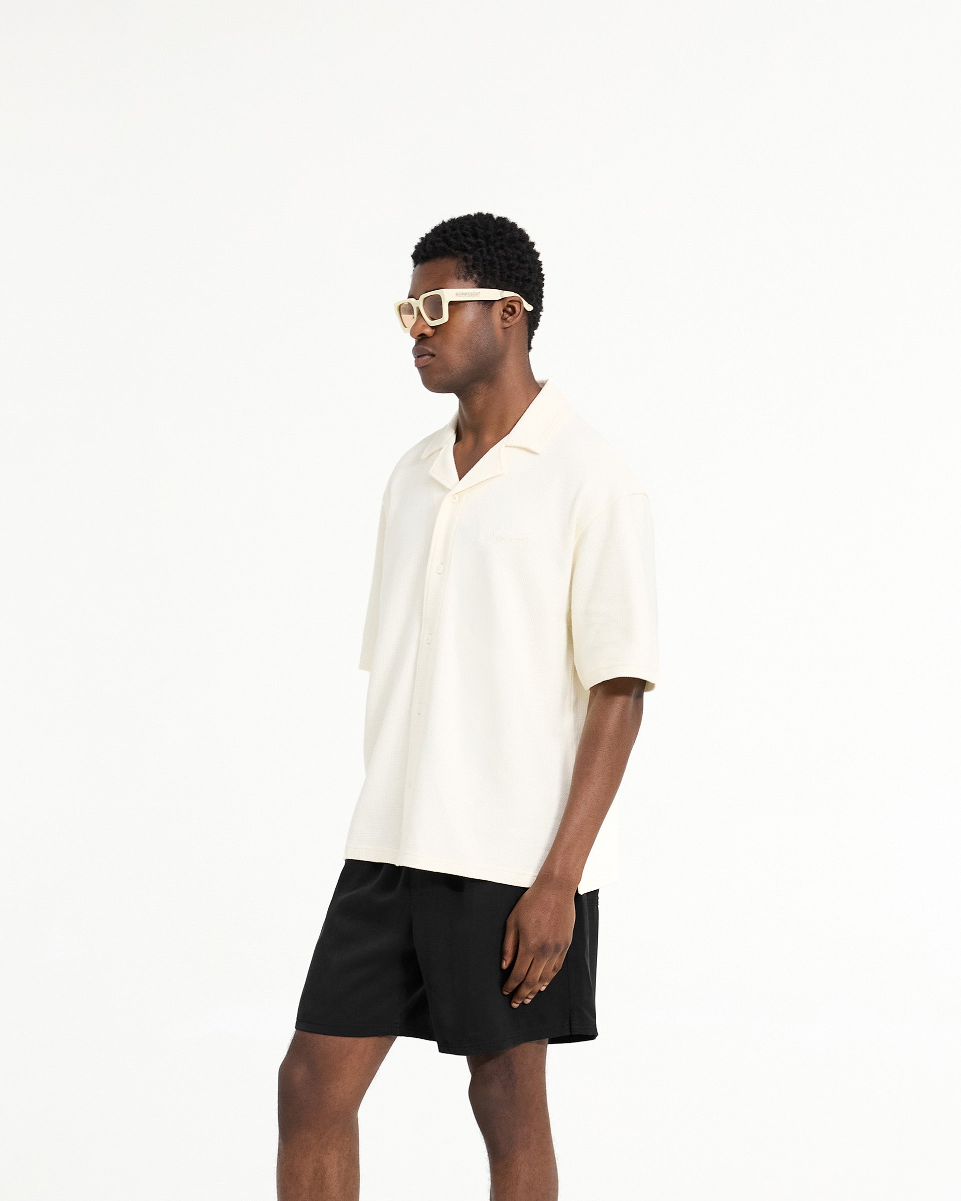 Back product image of a mens white shirt on a plain white background | Waffle Shirt in Antique White | Shirt with revere collar and side split hem | SC24 Shirts | Represent Clo