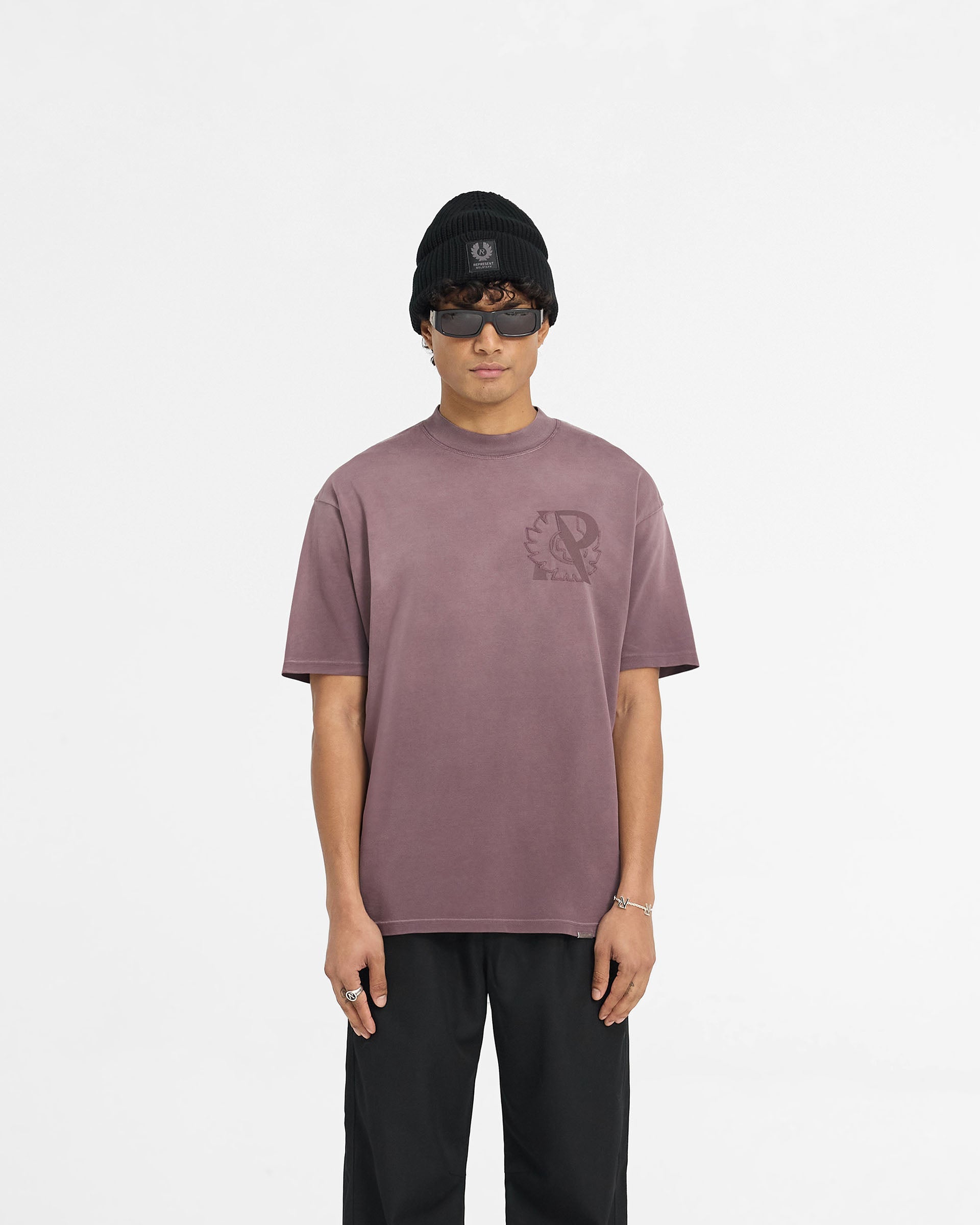 Man wearing a plum t-shirt on a plain white background | Represent X Belstaff Outline Phoenix T-Shirt in Plum | Oversized t-shirt with Initial and Phoenix logos | Exclusives T-Shirts | Represent Clo