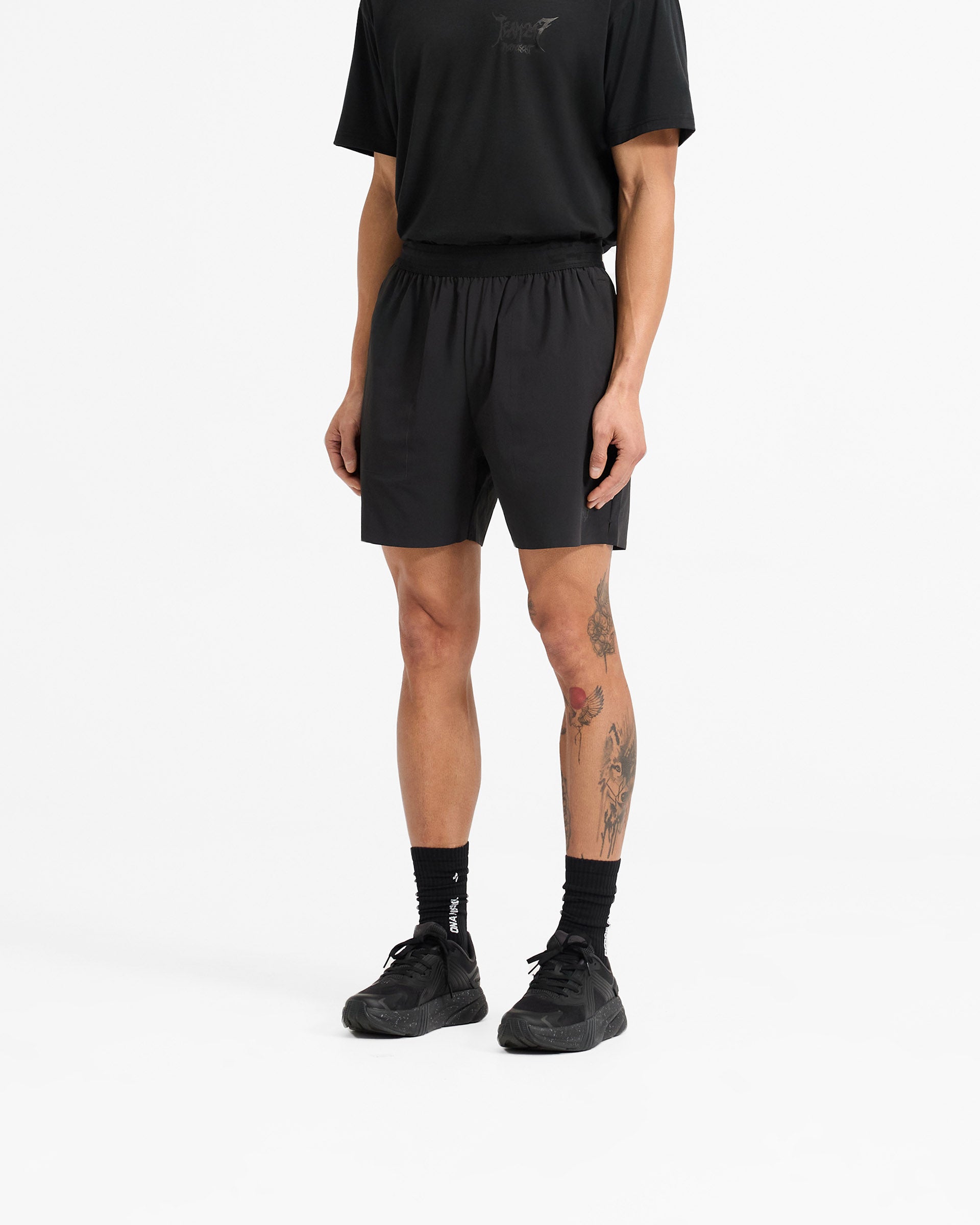 Man wearing black shorts on a plain white background | Team 247 X END Fused Short in Jet Black | Performance shorts with 4-way stretch and quick-drying fabric | 247 Shorts | Represent Clo