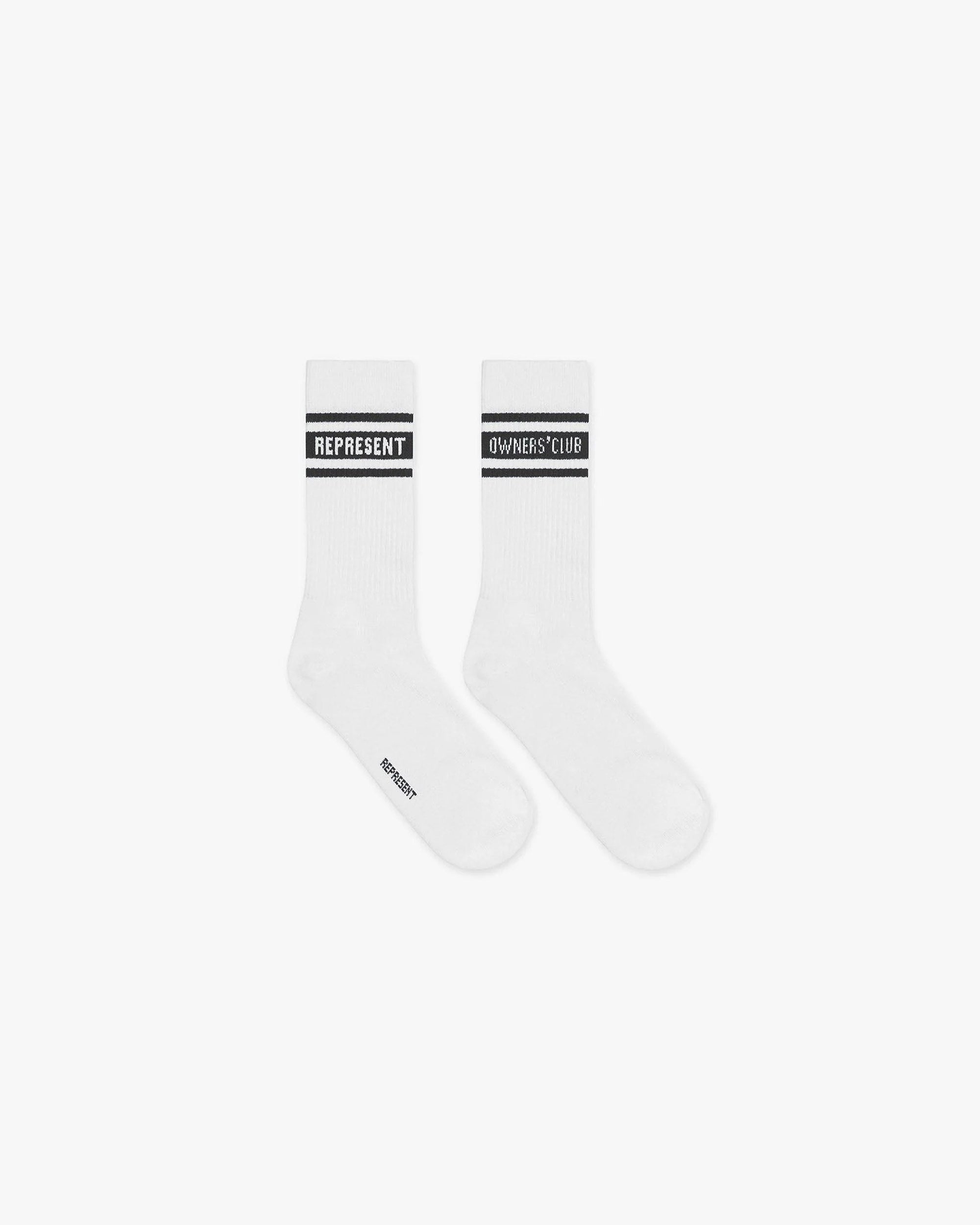 Front product image of mens white and black socks on a plain white background | Represent Owners Club Socks in Flat White Black | Embroidered logo socks | Owners Club Accessories | Represent Clo