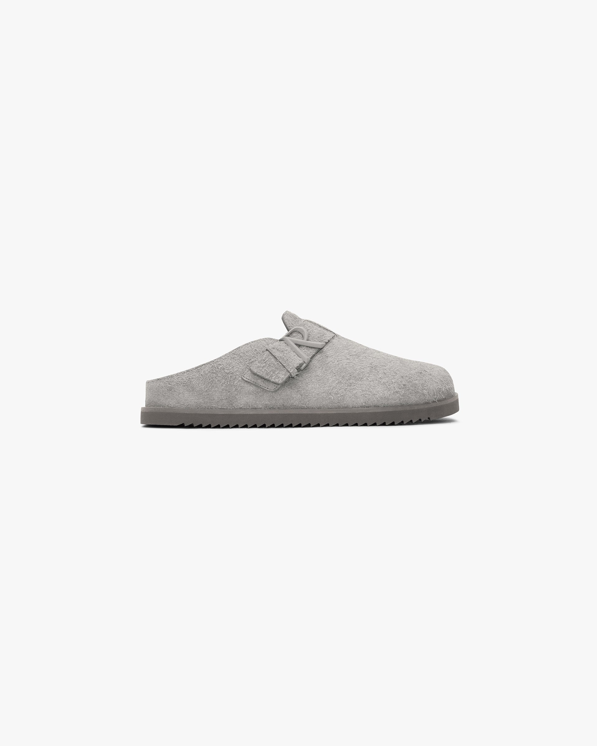 Front product image of a mens grey mule sneaker on a plain white background | Initial Mule in Grey | Mule sneaker with rubber toe cap and chunky lacing | SS24 Footwear | Represent Clo