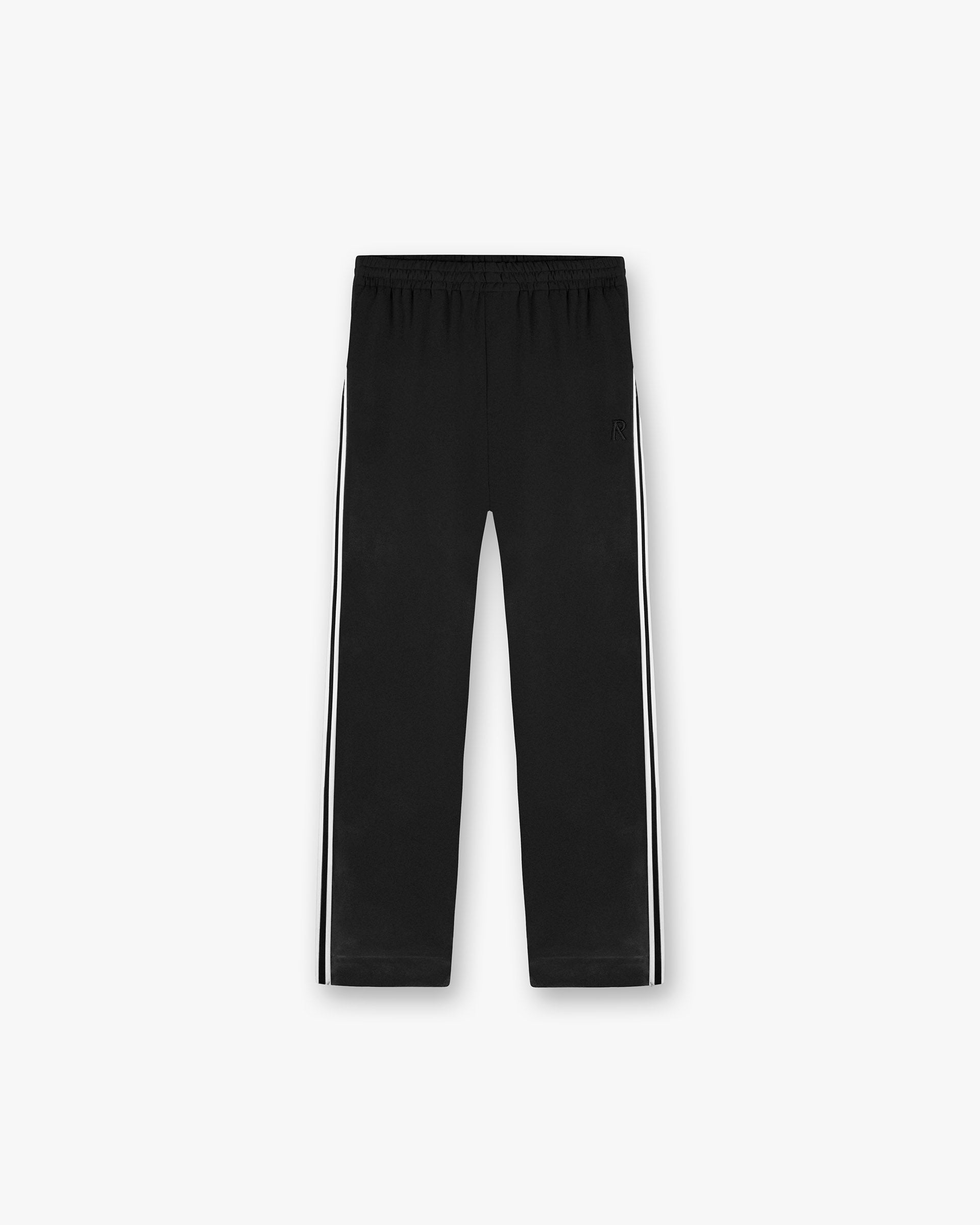 Front product image of mens black tailored track pants on a plain white background | Tailored Track Pant in Jet Black | Slim fit track pants with elasticated waistband | SS25 Pants | Represent Clo