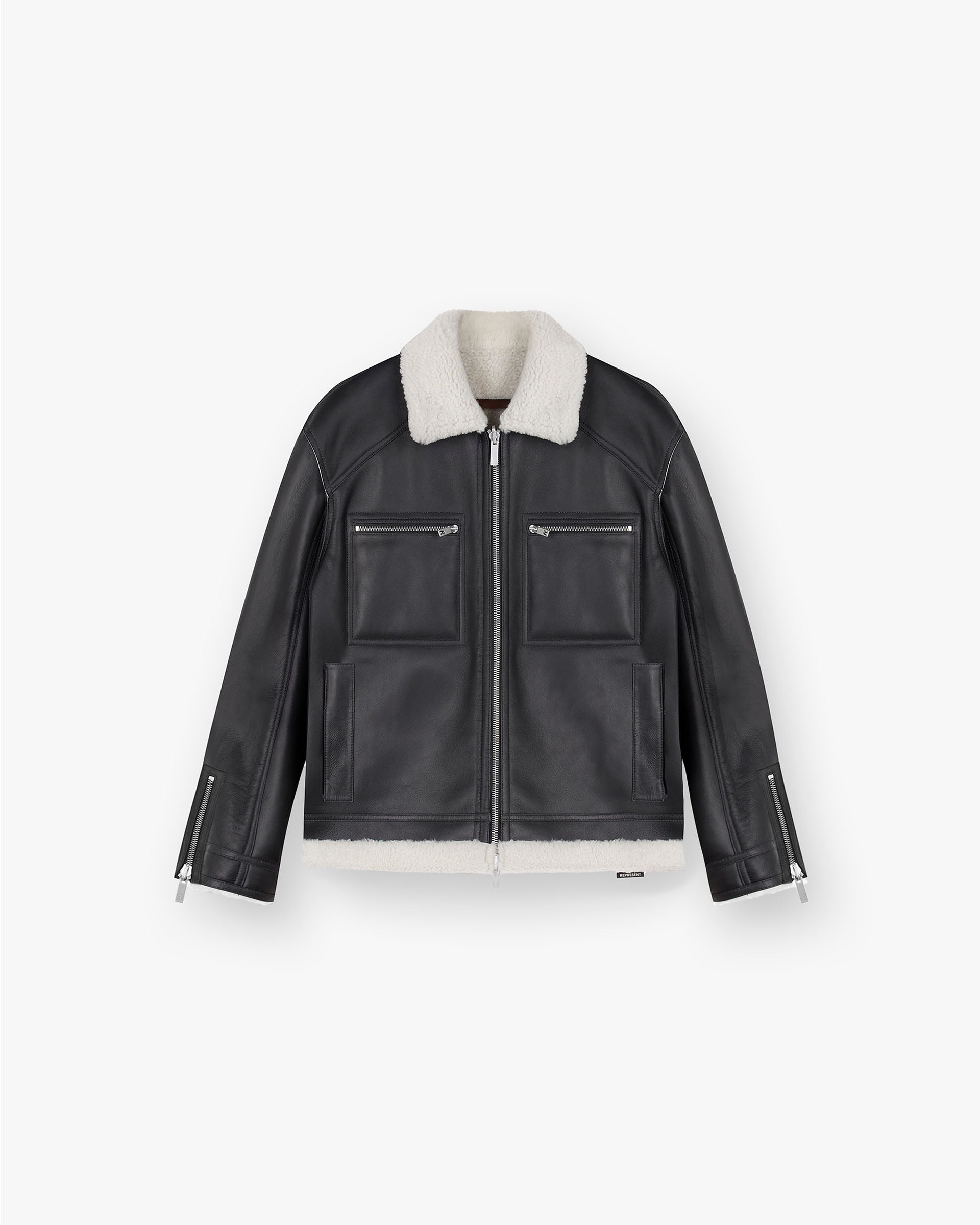 Front product image of a mens black reversible shearling jacket on a plain white background | Reversible Shearling Jacket in Black | Outerwear with reversible design | FW24 Outerwear | Represent Clo