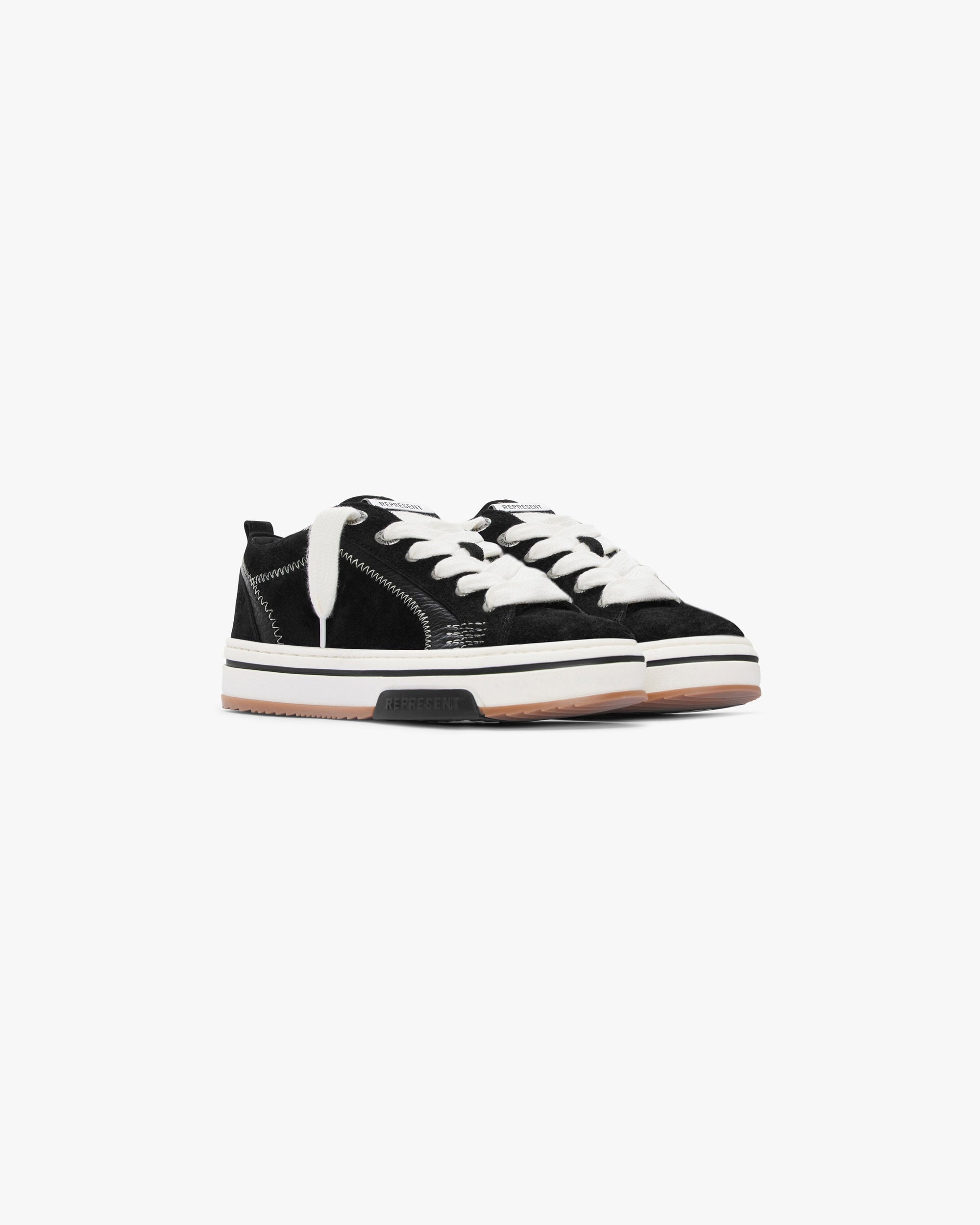 Back product image of a mens black sneaker on a plain white background | HTN Low in Black | Low top sneaker with hairy suede upper and chunky lacing | FW23 Footwear | Represent Clo