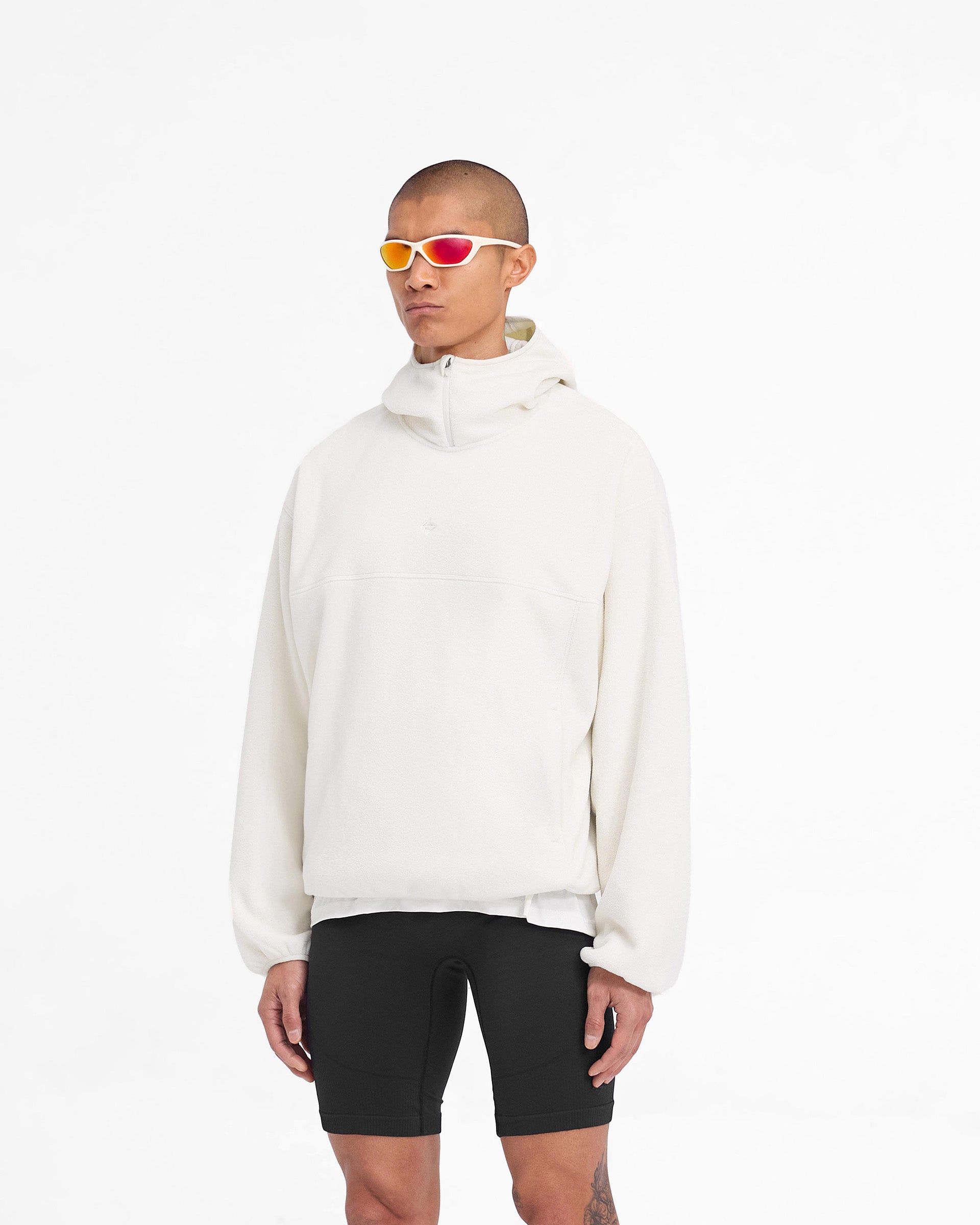 Man wearing an oversized fleece hoodie in white on a plain white background | 247 Fleece Hoodie in Papyrus | Oversized boxy fit fleece hoodie with zip pockets | 247 Hoodies | Represent Clo