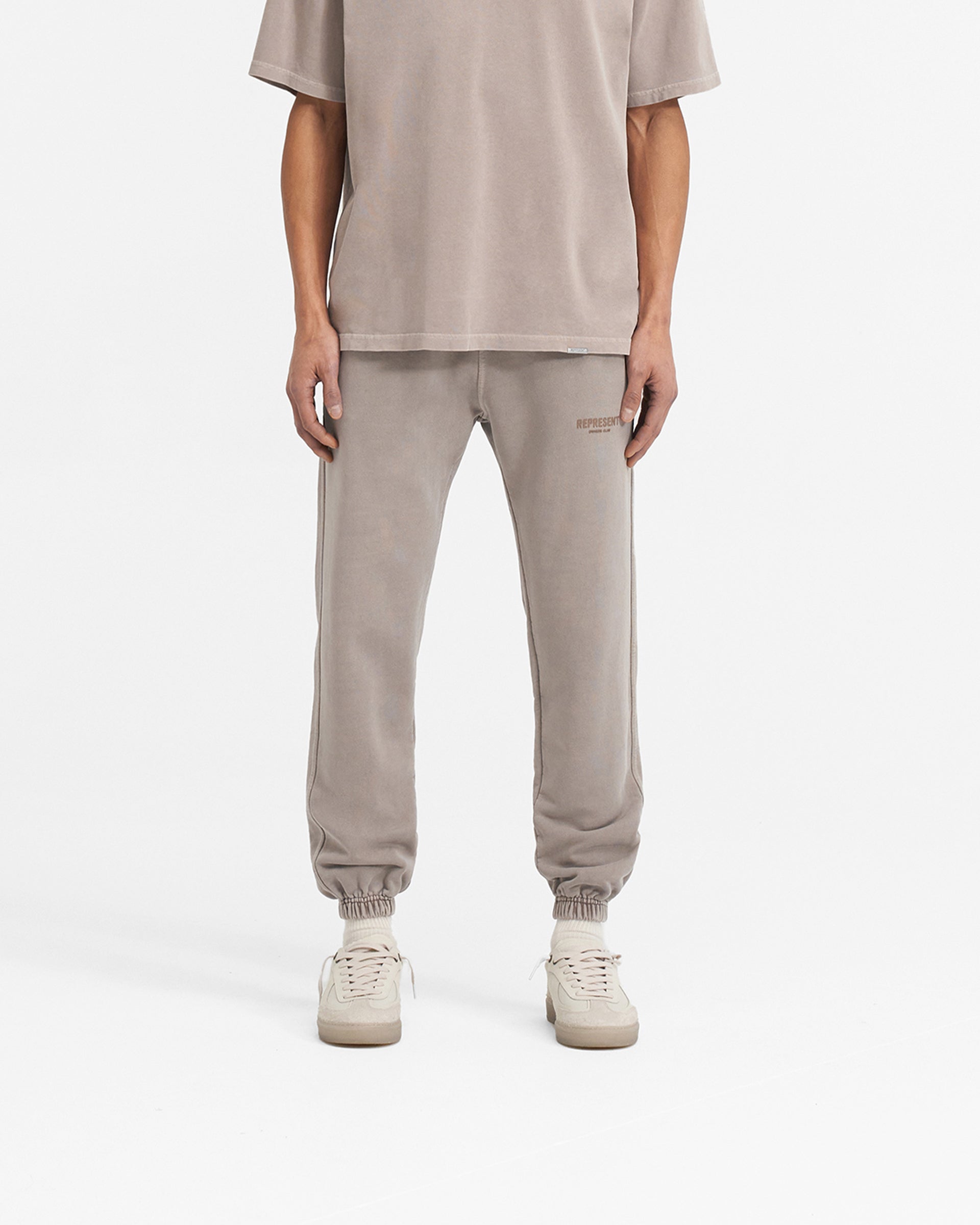 Back product image of mens mushroom sweatpants on a plain white background | Represent Owners Club Sweatpant in Mushroom | Relaxed silhouette with elasticated waistband and cuffs | Owners Club Pants | Represent Clo