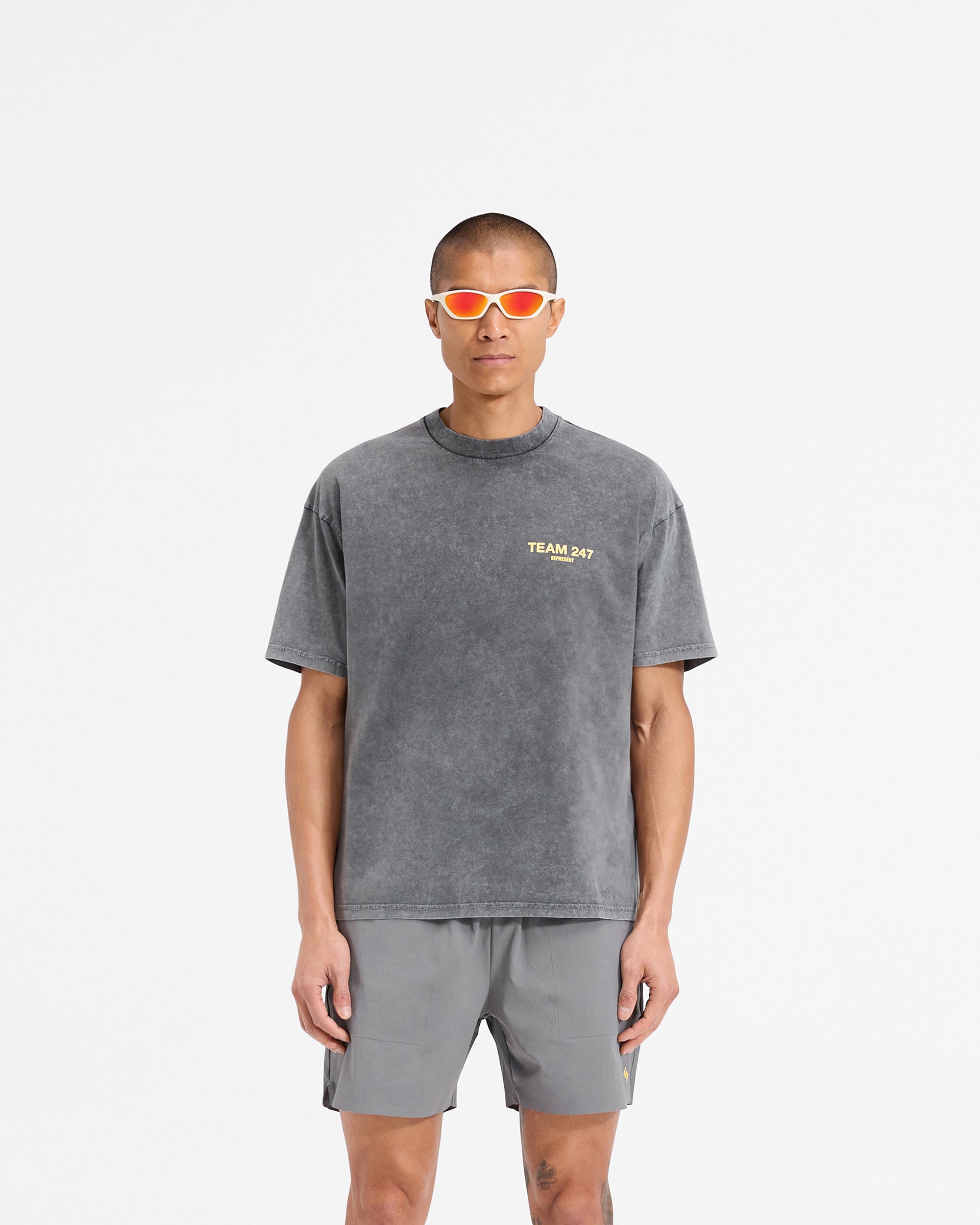Man wearing an oversized grey t-shirt on a plain white background | Team 247 Oversized T-Shirt in Pewter Lemon | Quick drying 4-way stretch oversized t-shirt | 247 T-Shirts | Represent Clo
